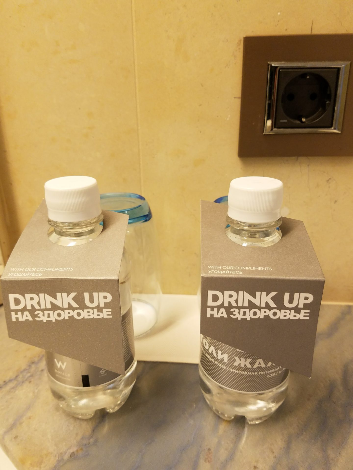 a couple of bottles with labels on top of them