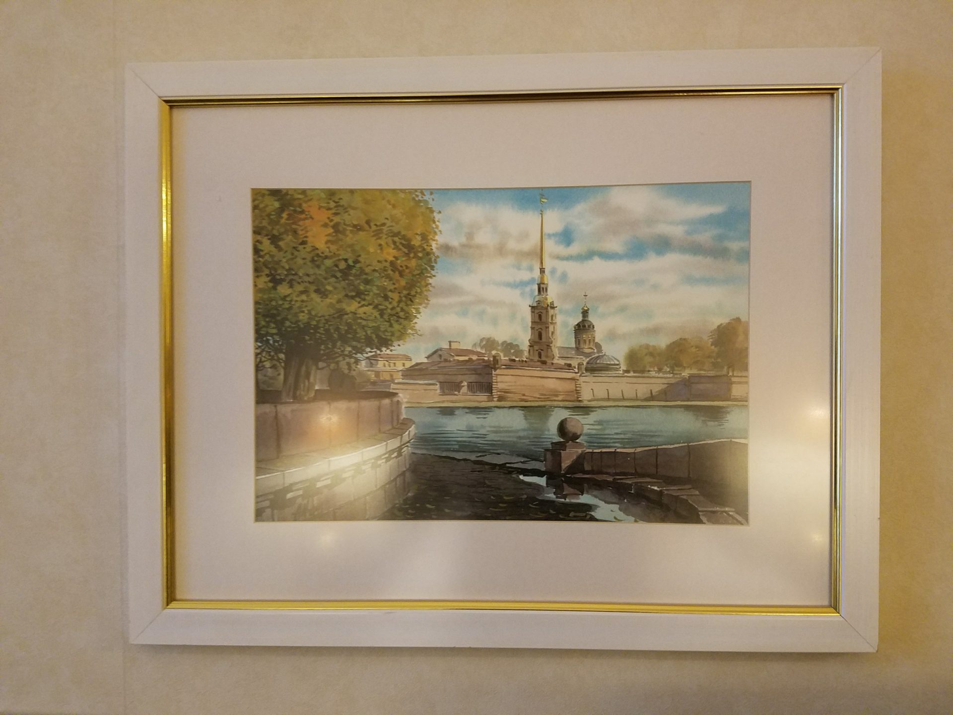 a framed picture of a city