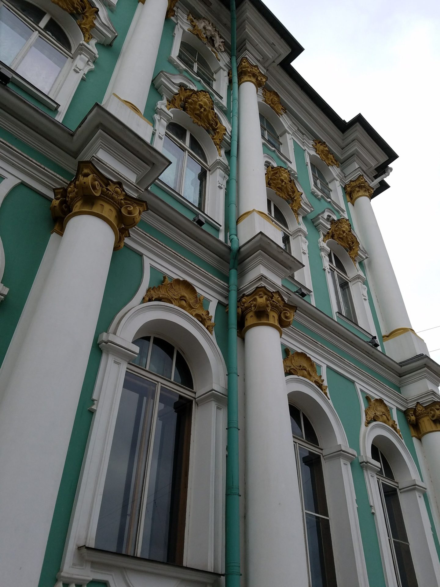 a building with columns and gold trim