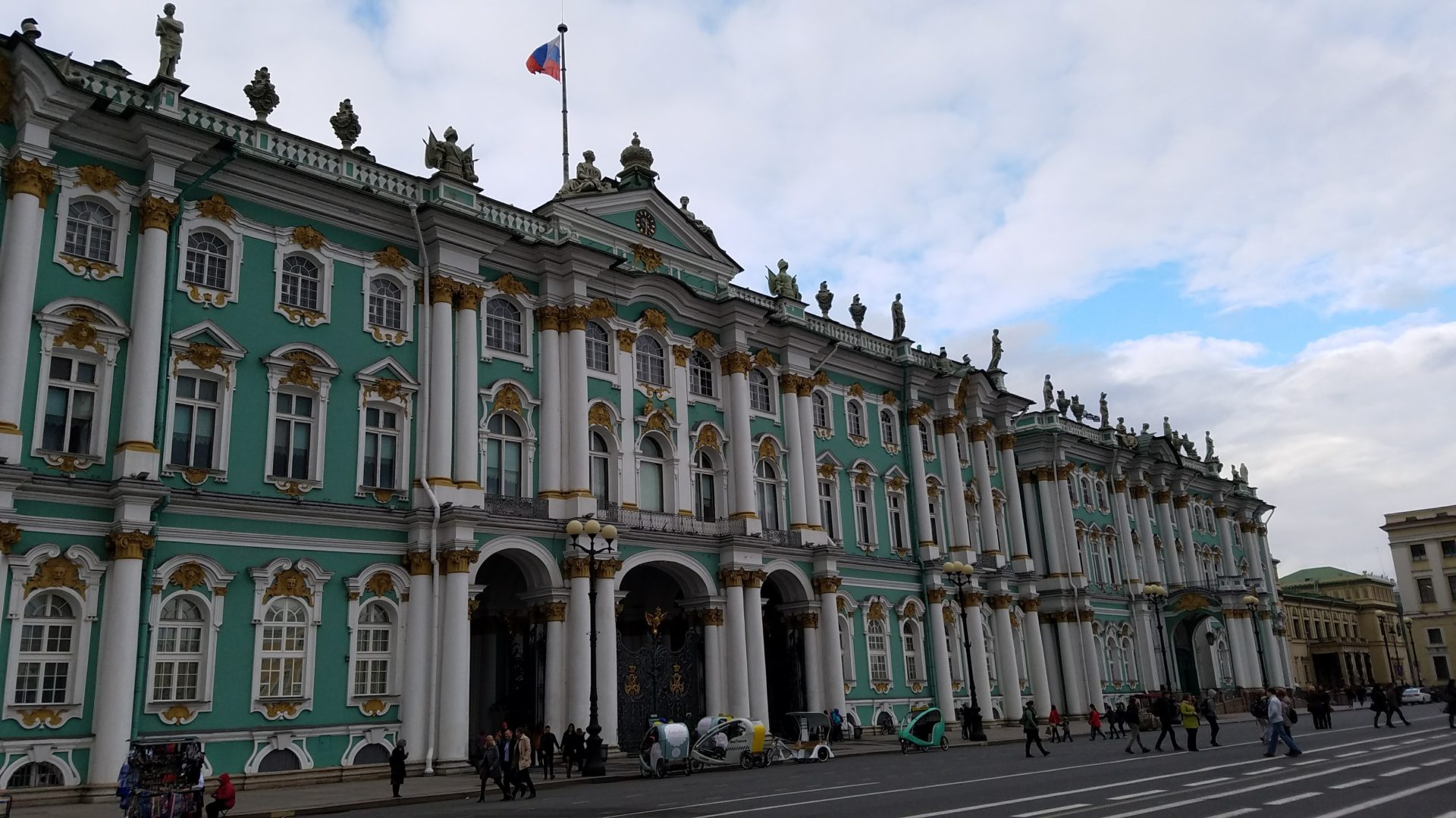 Winter Palace with columns and statues on top of it