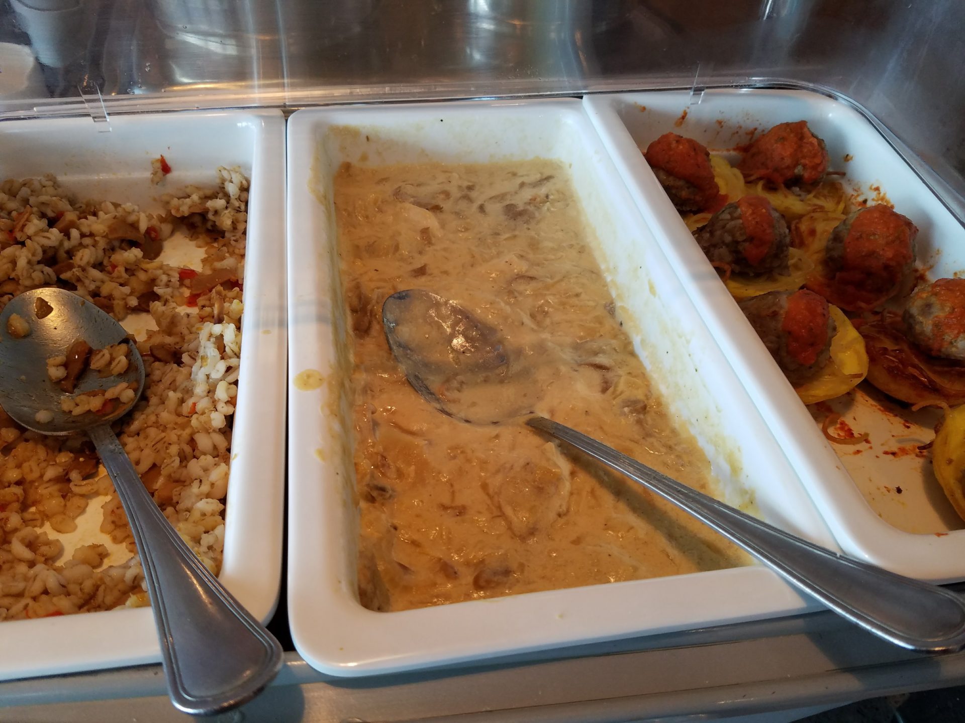 a tray of food with spoons