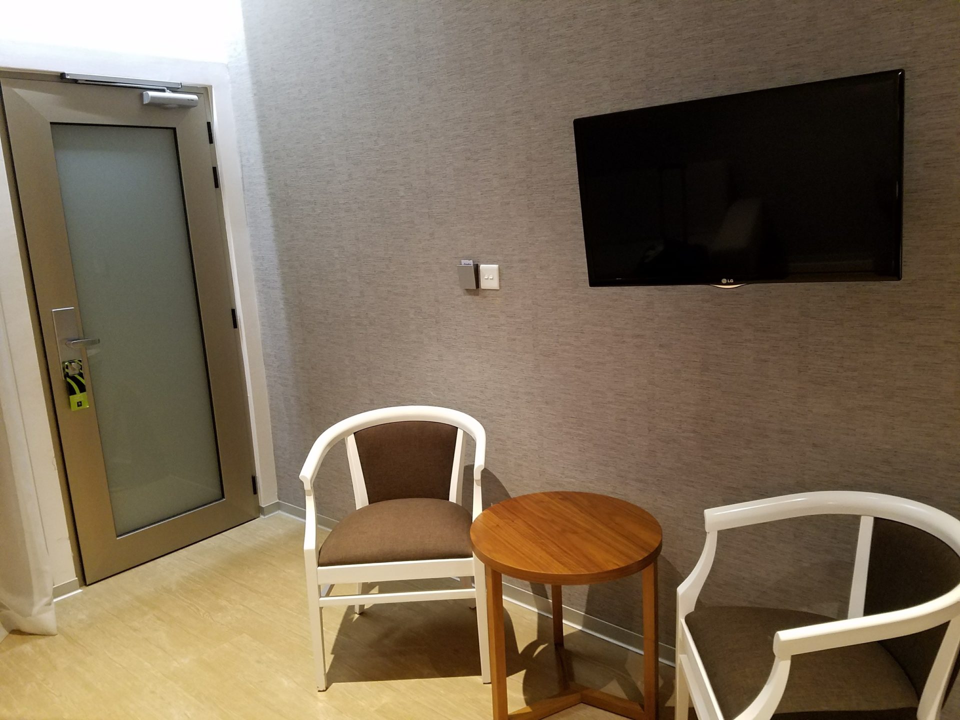 a room with chairs and a tv