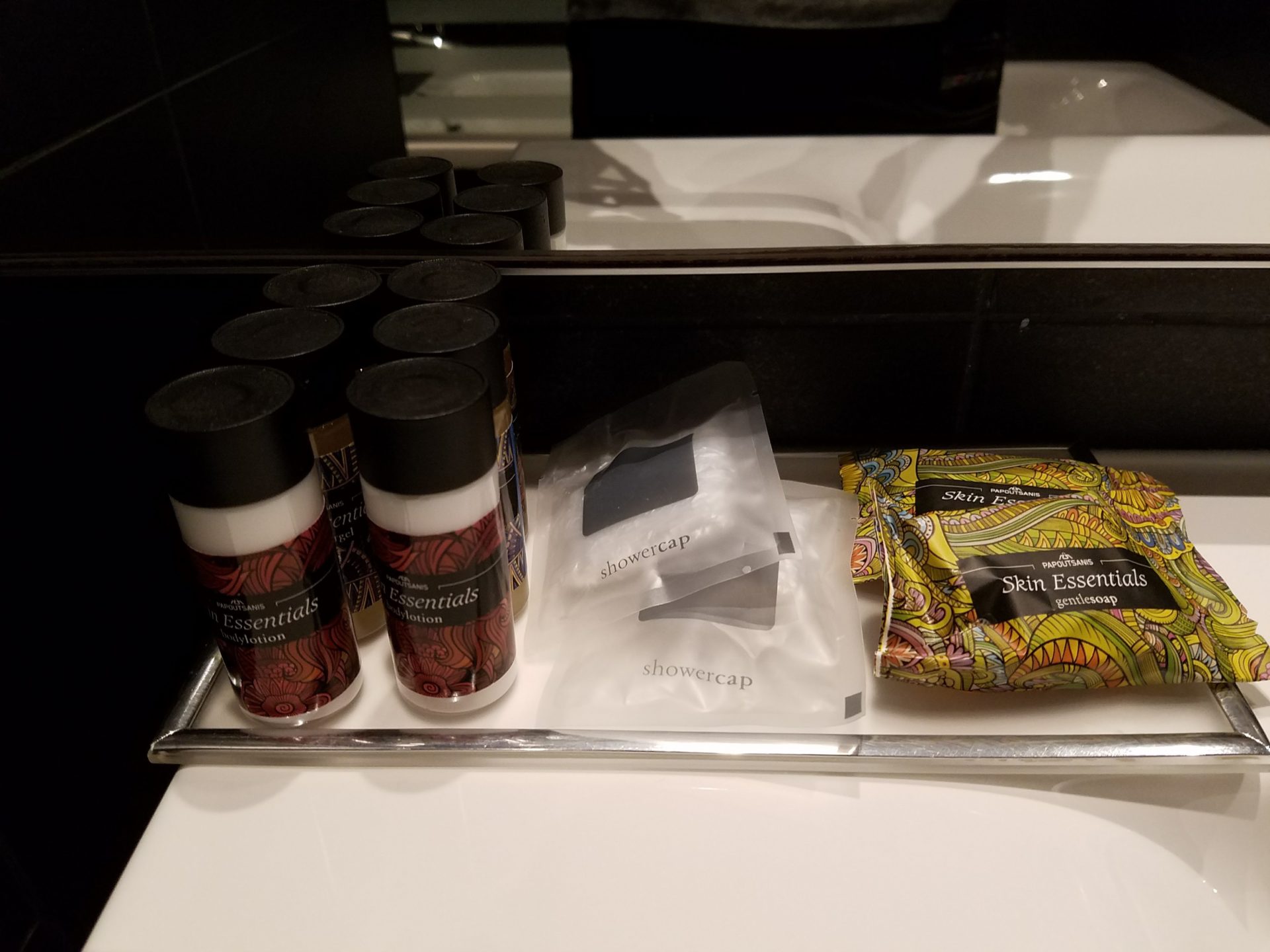 a bathroom counter with a few items on it