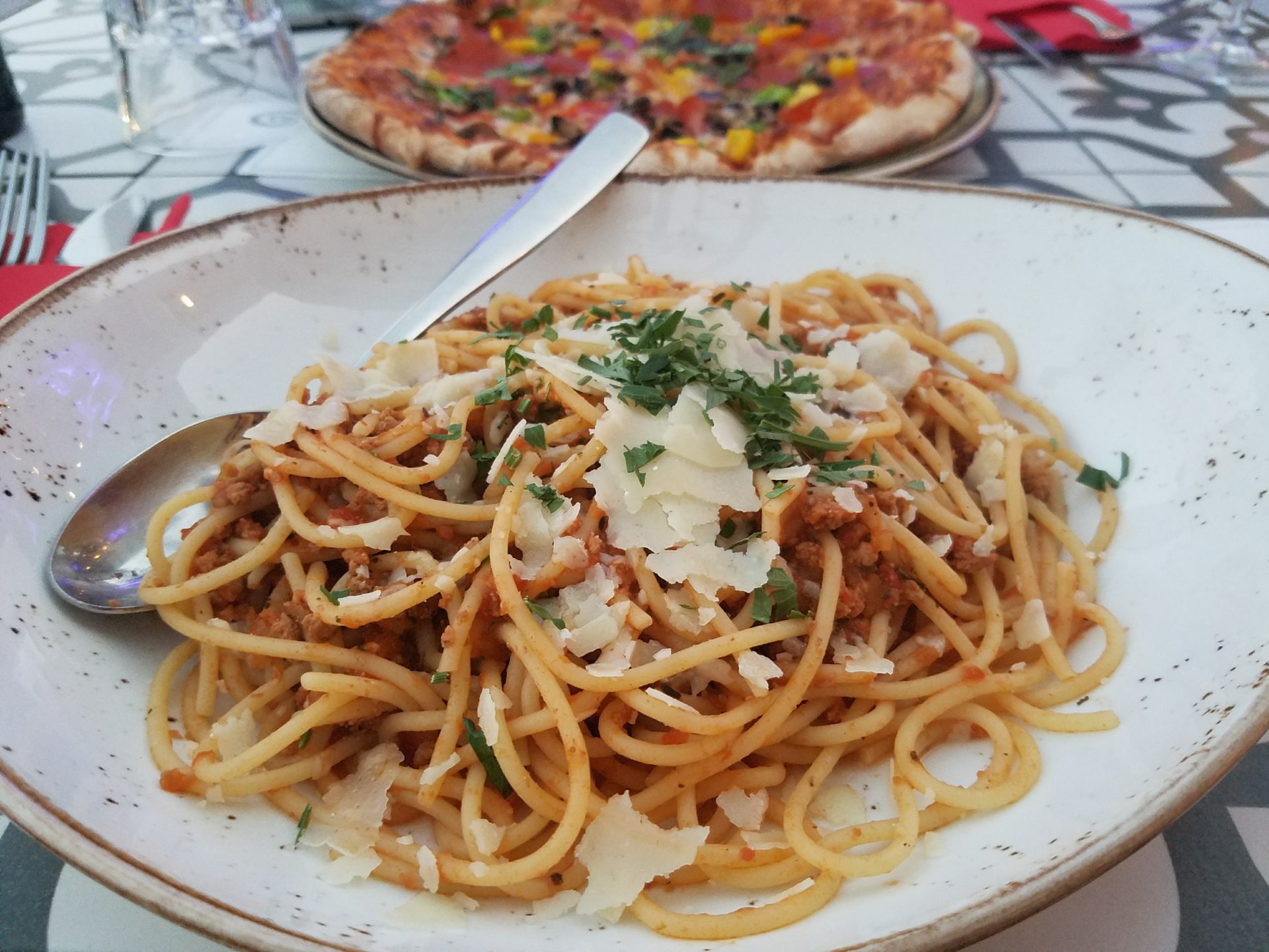 a plate of spaghetti and pizza