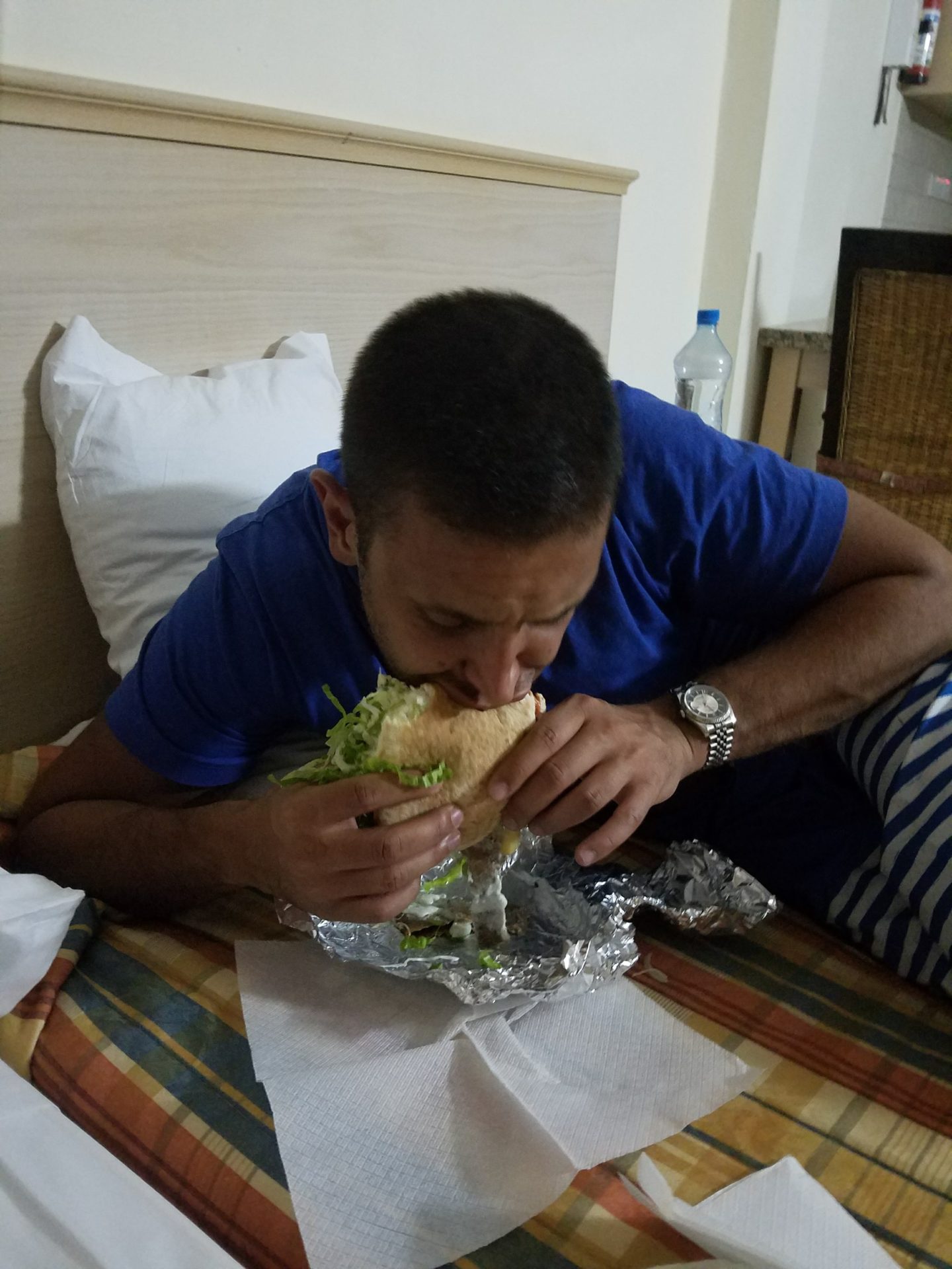 a man eating a sandwich