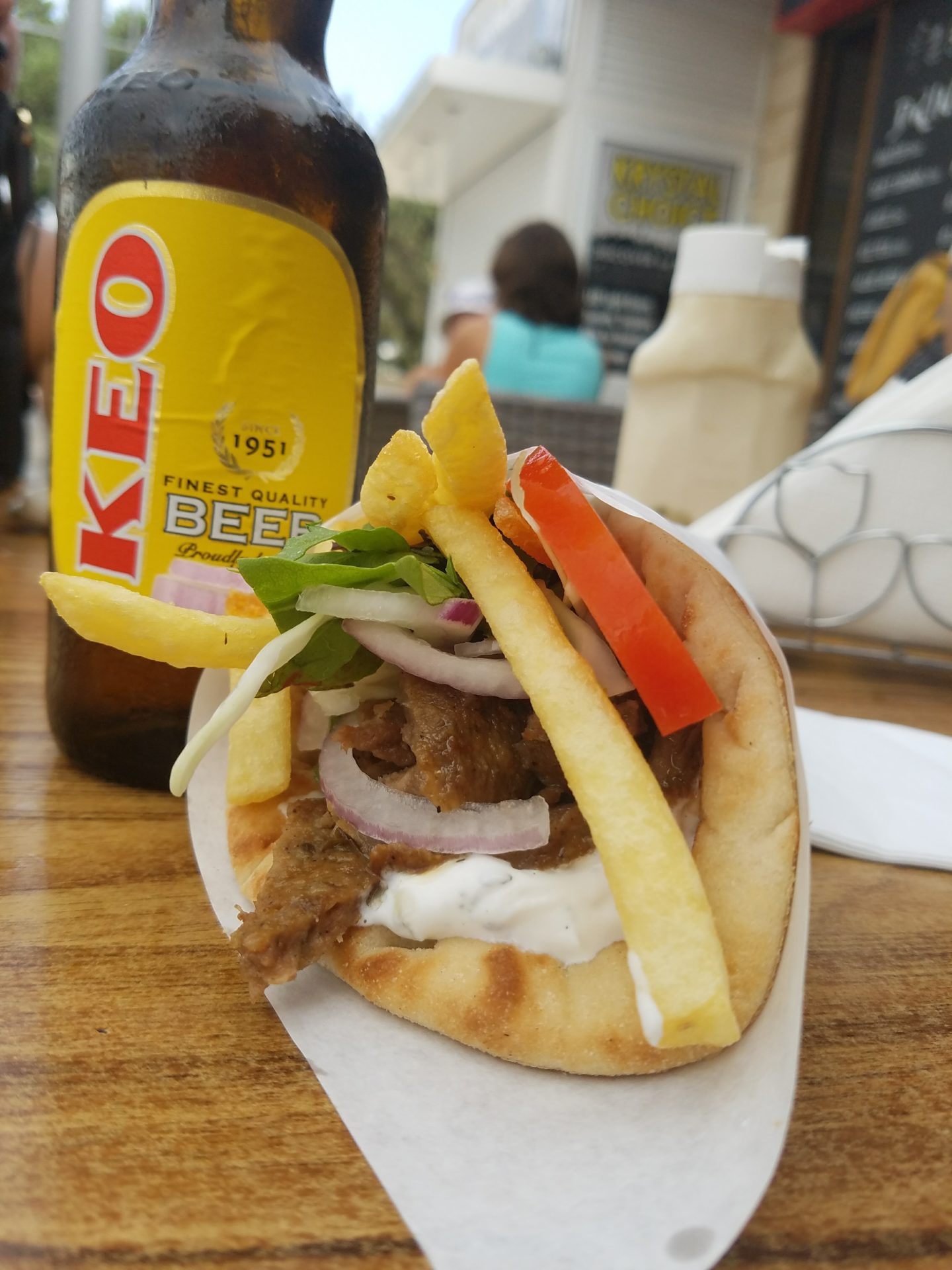 a pita bread with meat and vegetables on a table