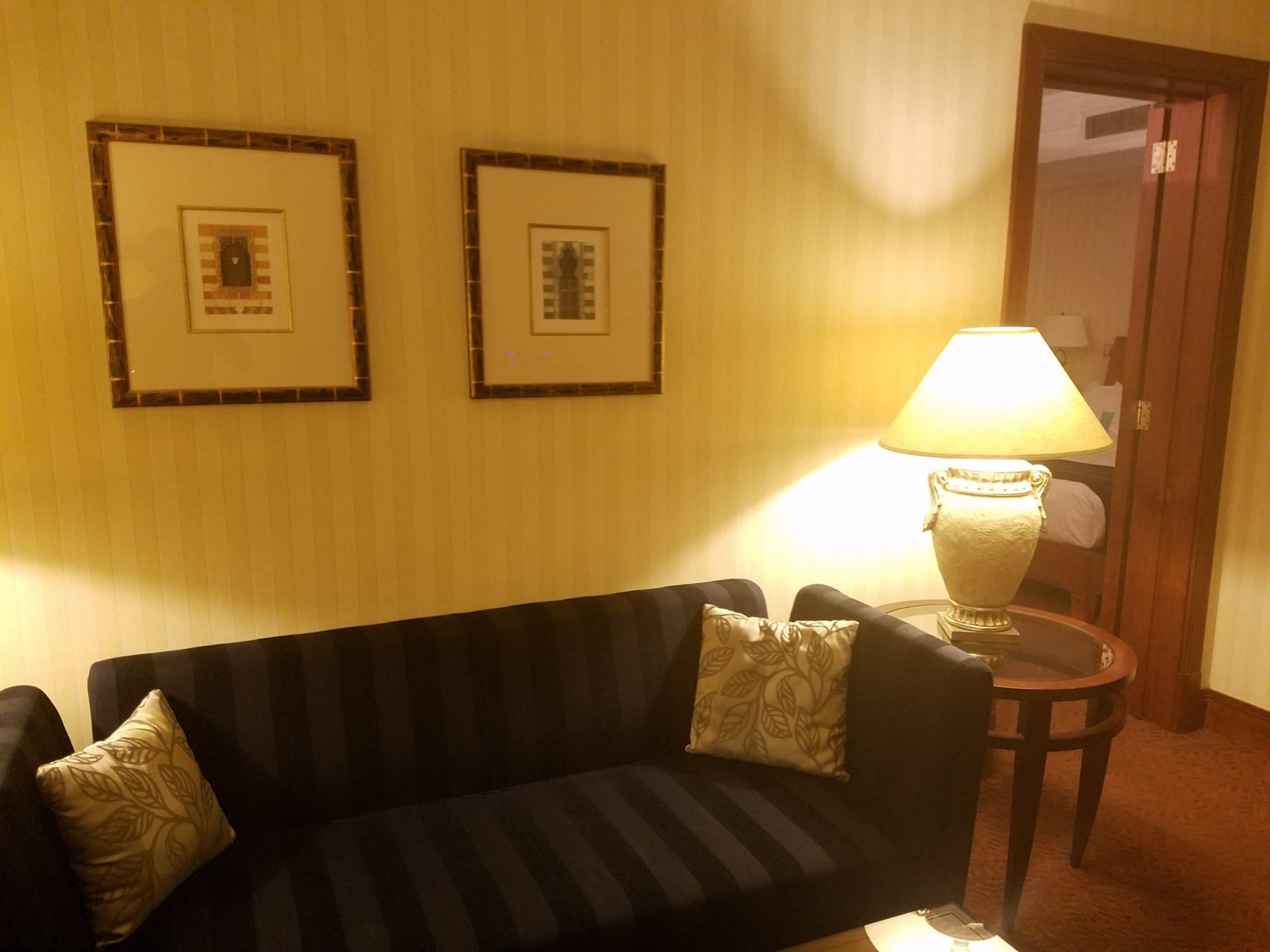 a couch and lamp in a room
