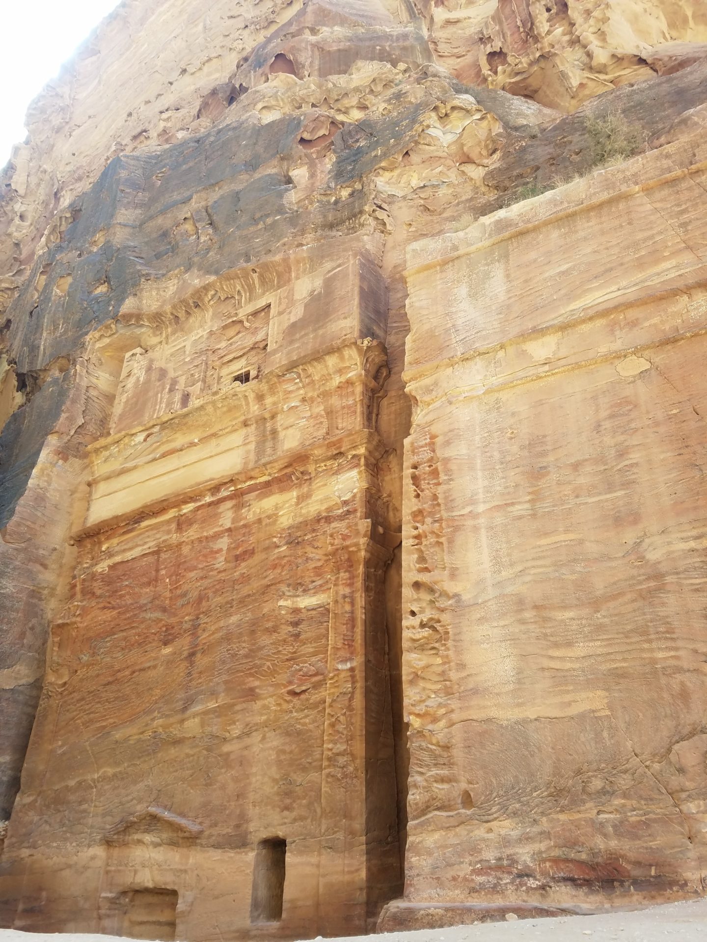 a rock wall with a rectangular doorway