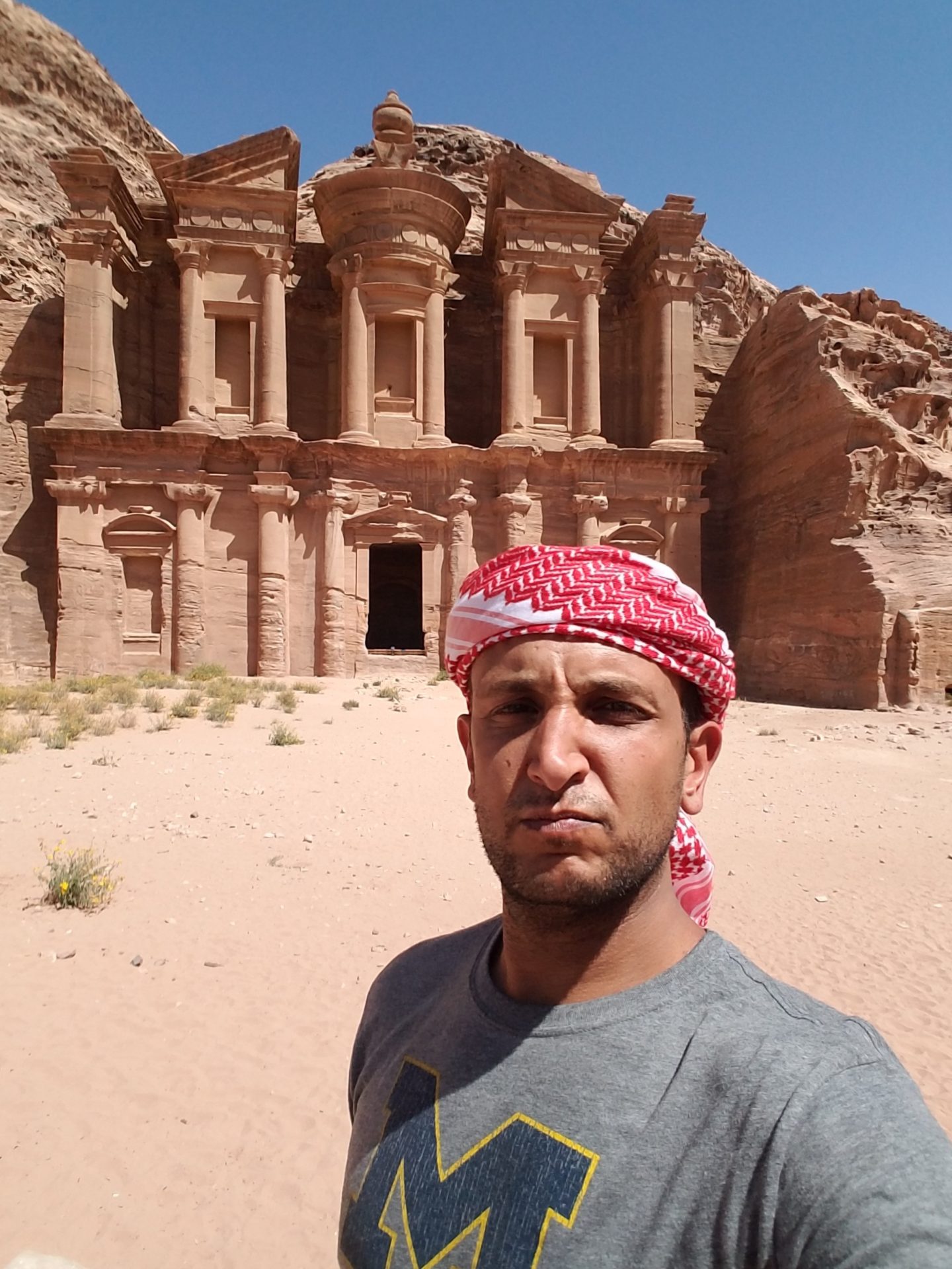 a man taking a selfie in front of Petra