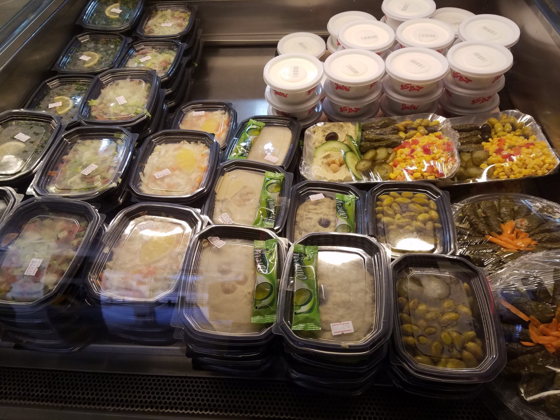 a group of plastic containers with food in them