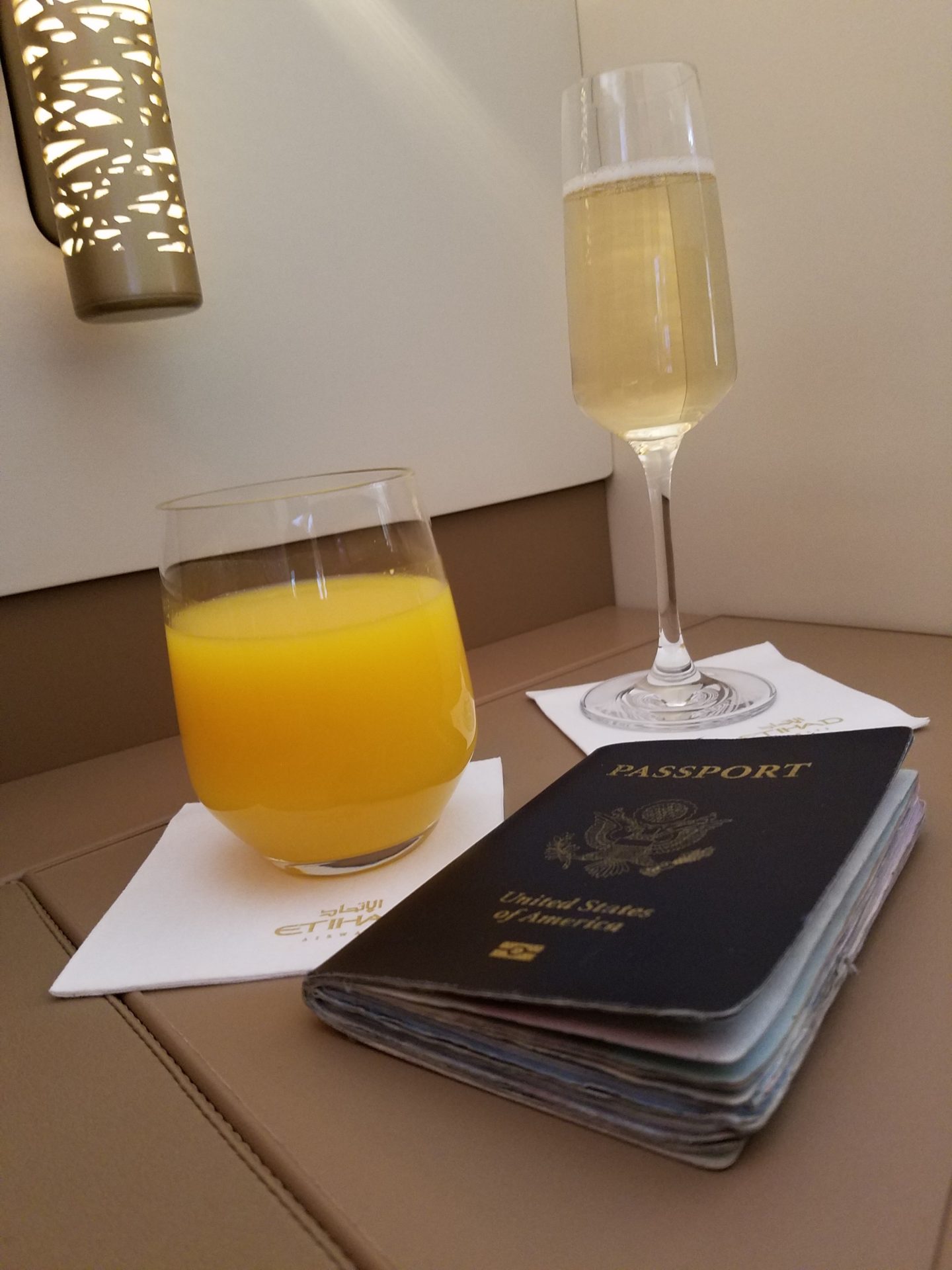 a passport and a glass of juice