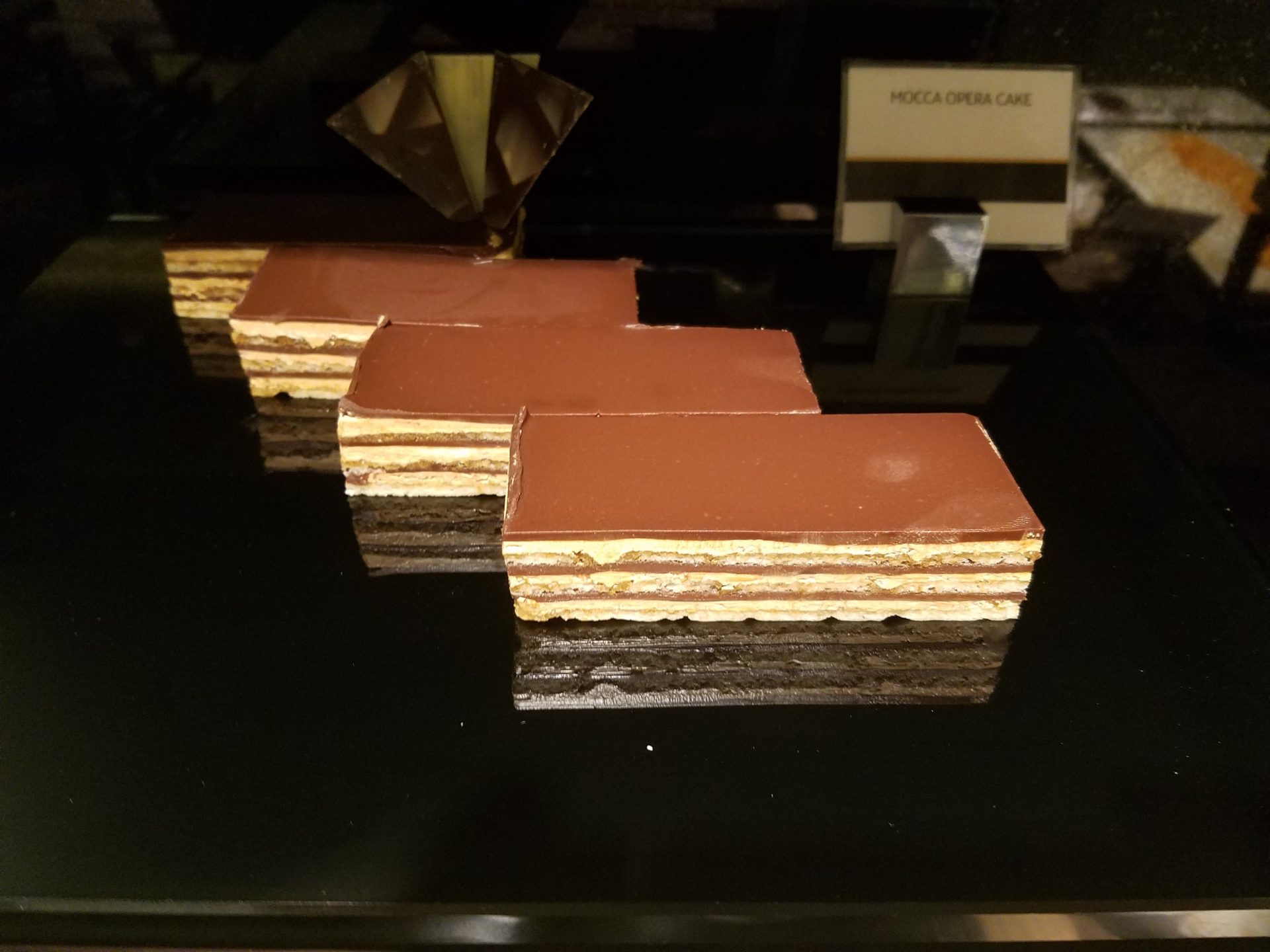 a group of chocolate cakes on a black surface