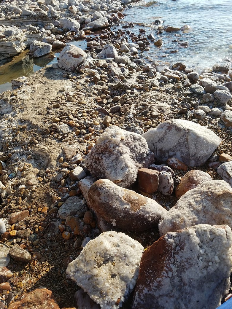 a rocky beach with rocks and water