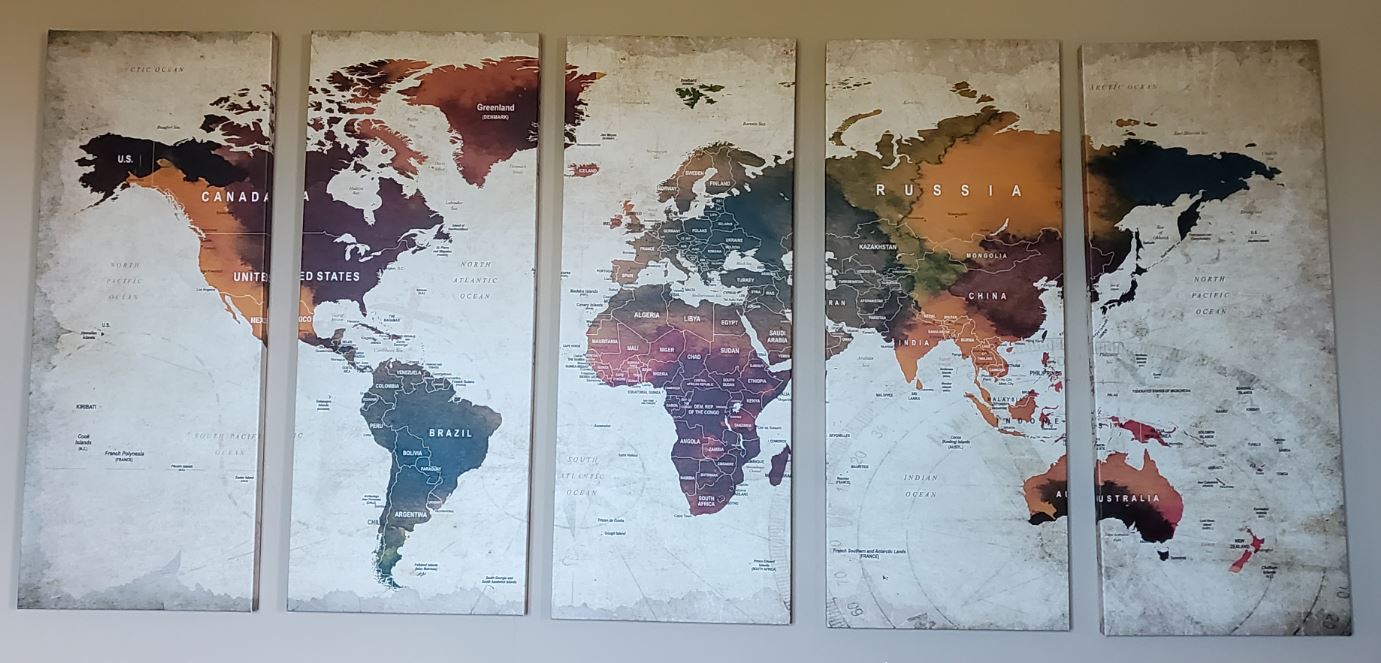 a group of maps on a wall