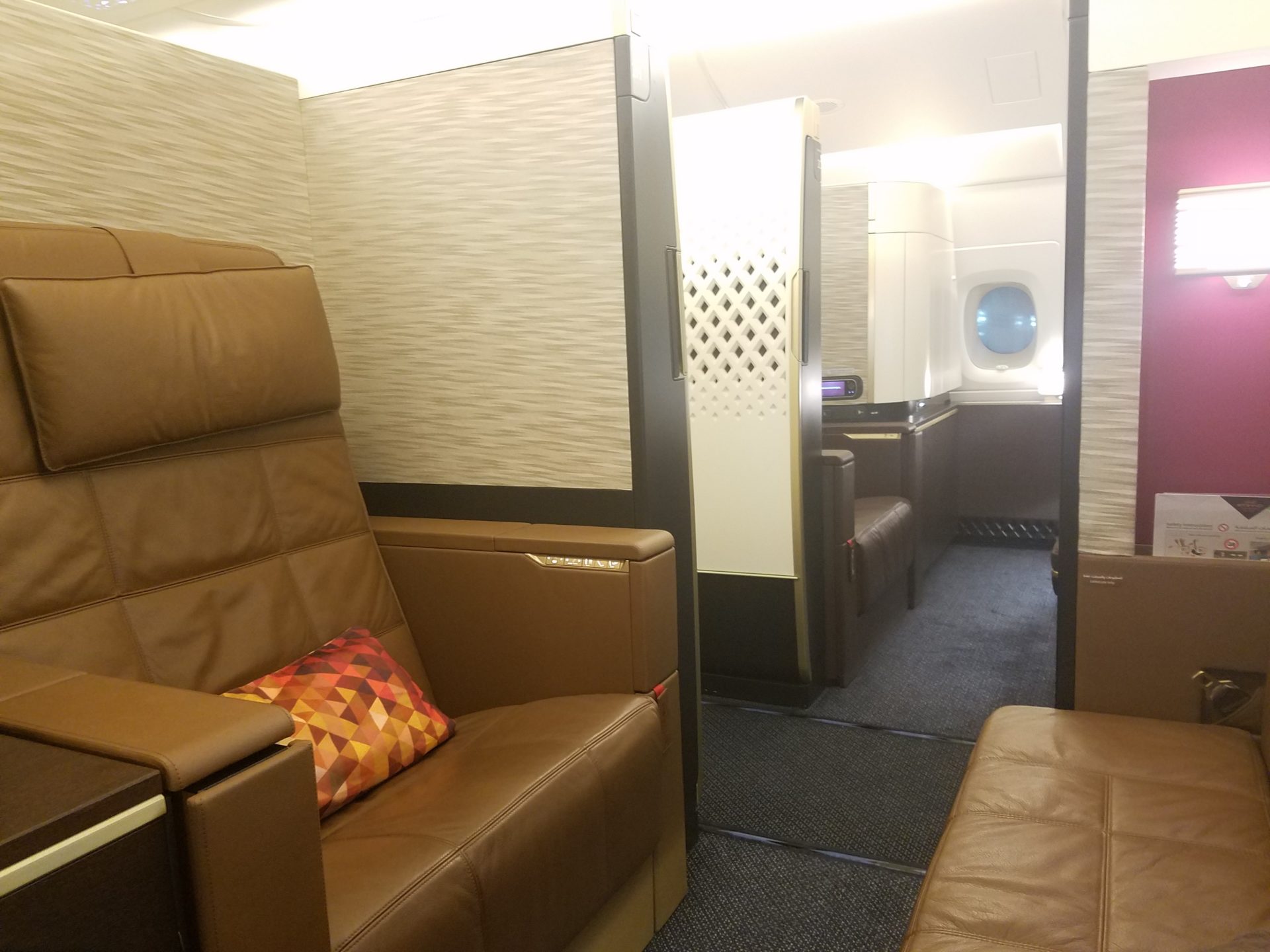 a brown leather couch in a plane
