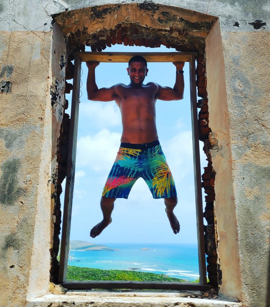 a man in swimsuit from a window