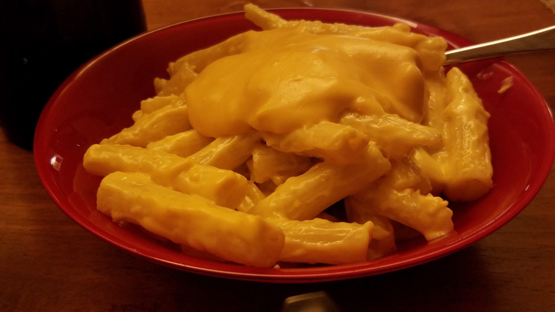 a plate of pasta with cheese on it