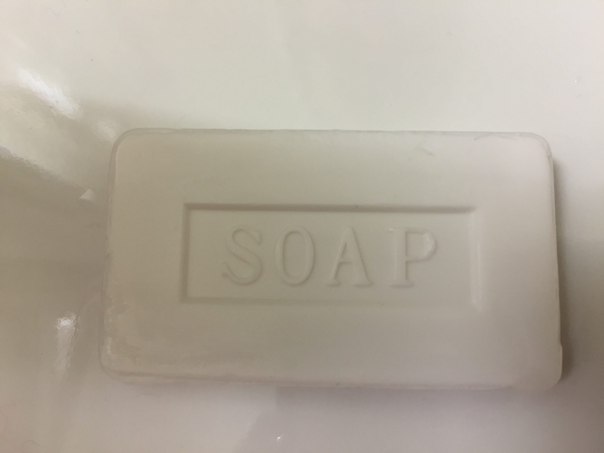a bar of soap on a white surface