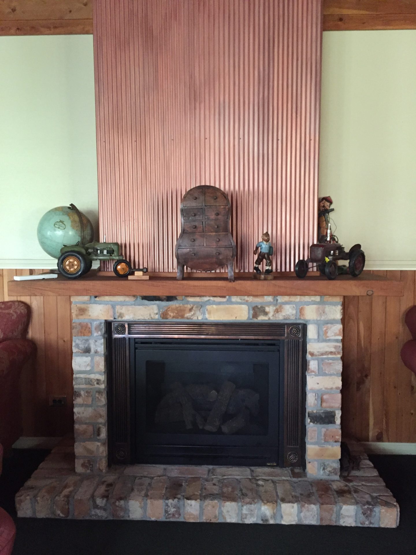 a fireplace with toys on top