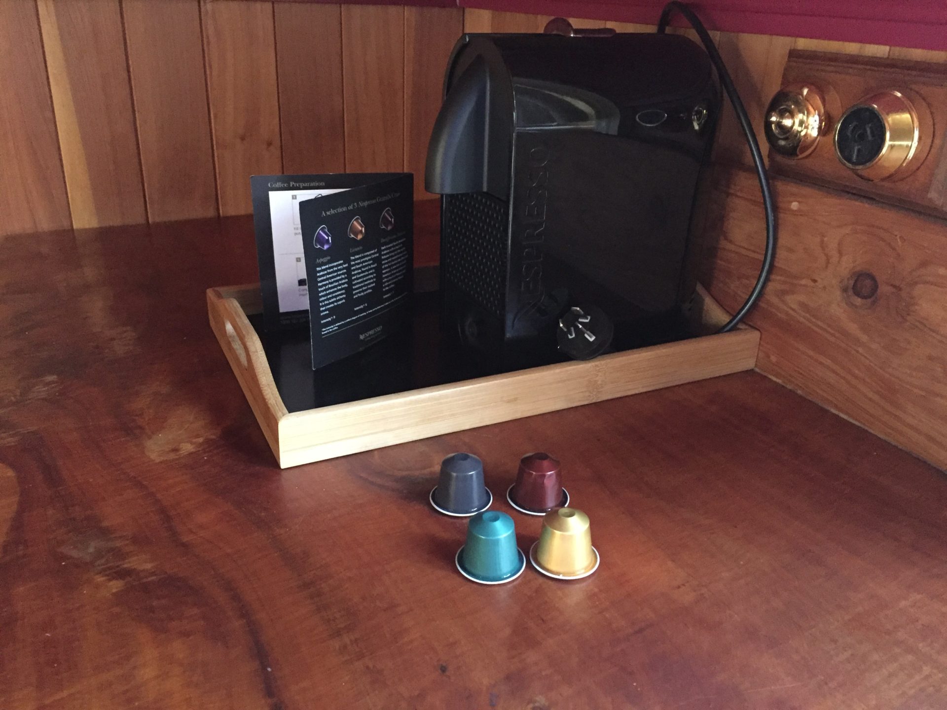 a coffee machine and capsules on a table