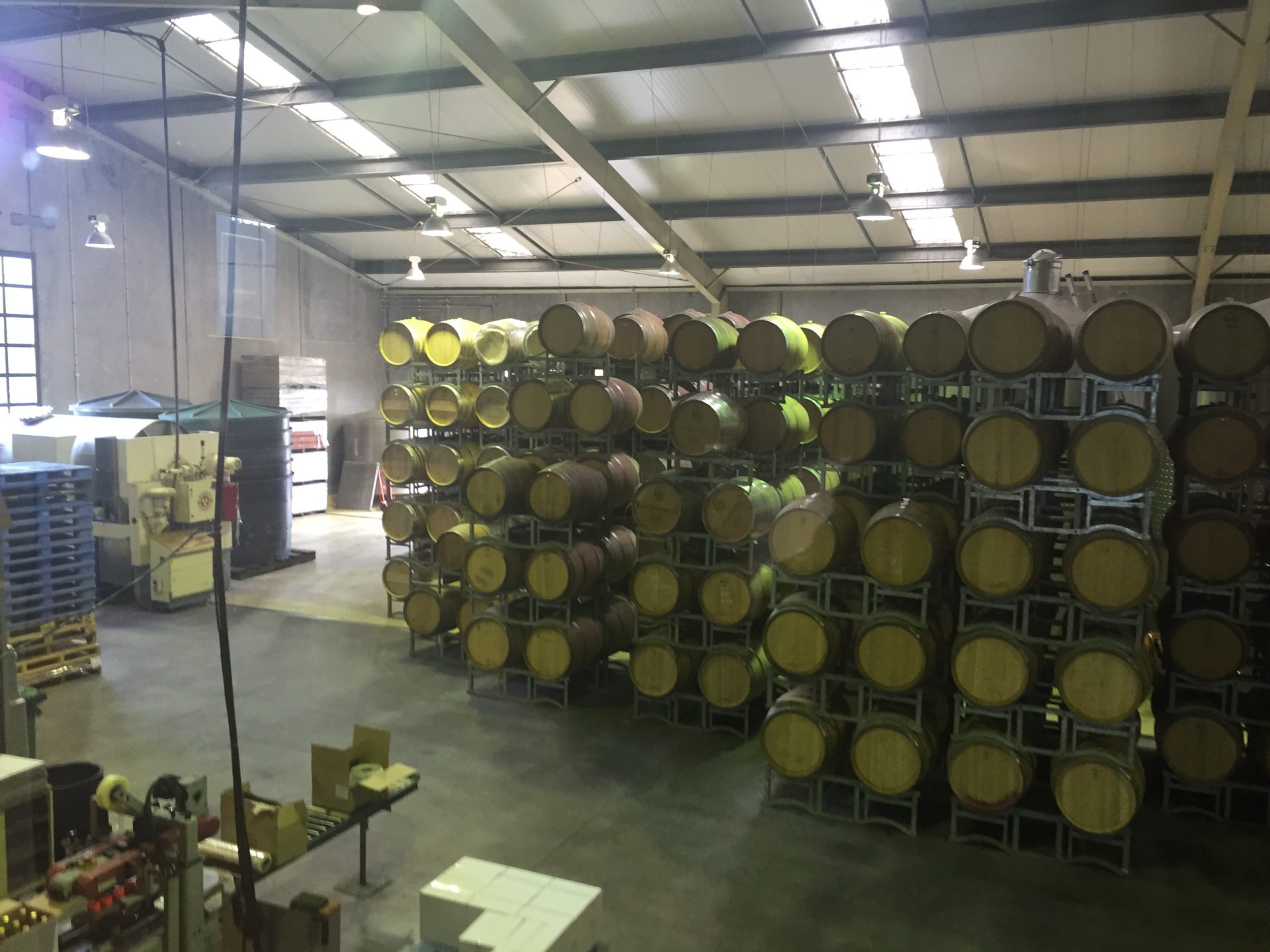 a large room with barrels stacked on top of each other