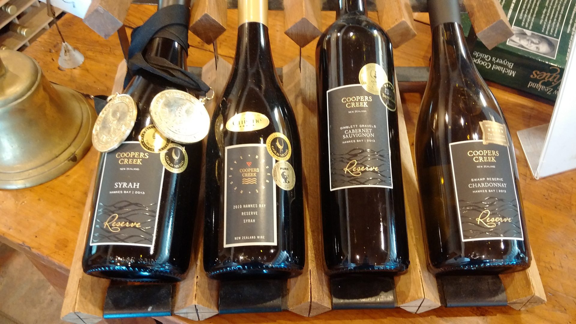 a group of wine bottles on a shelf