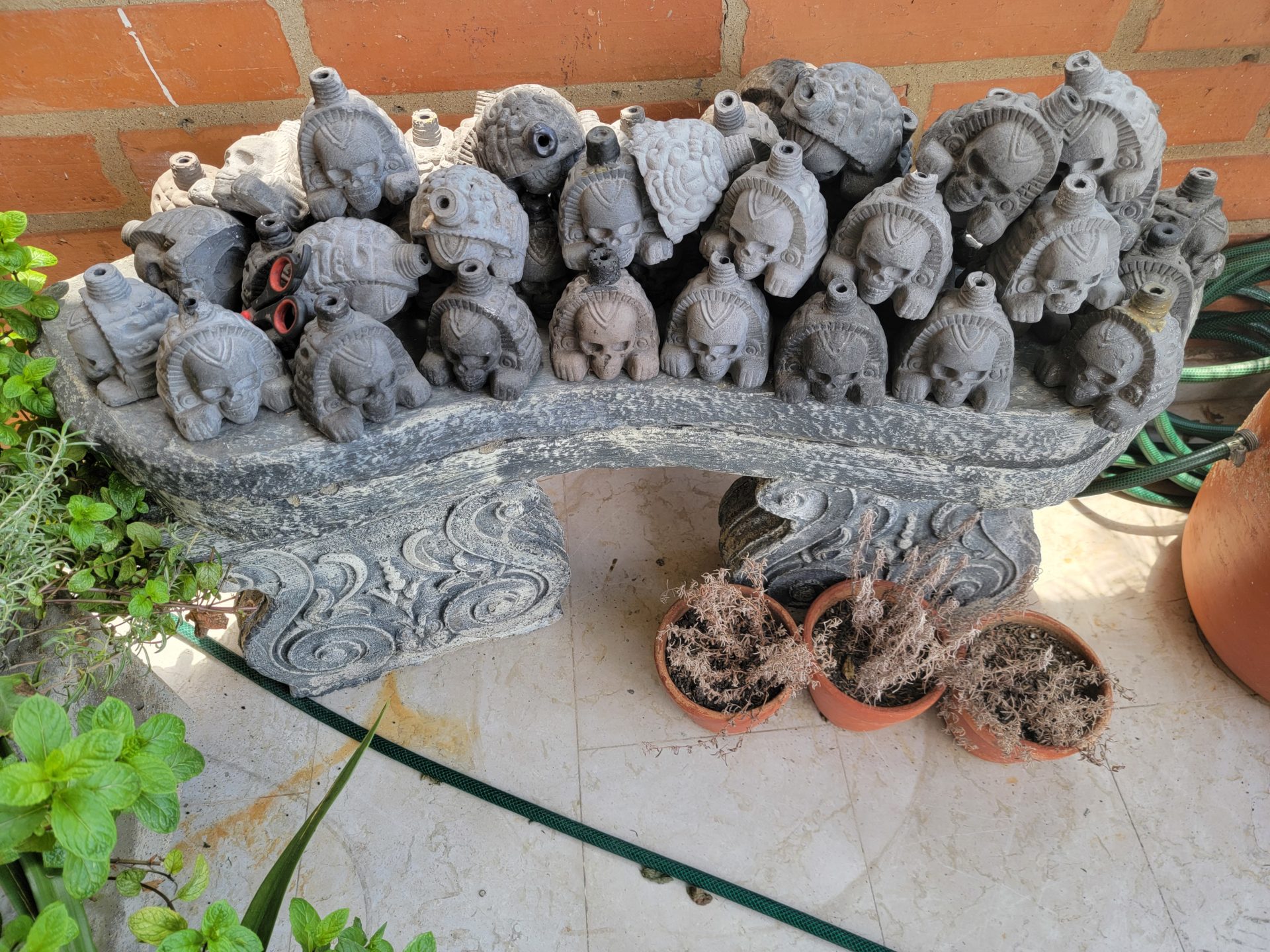 a group of small statues on a bench