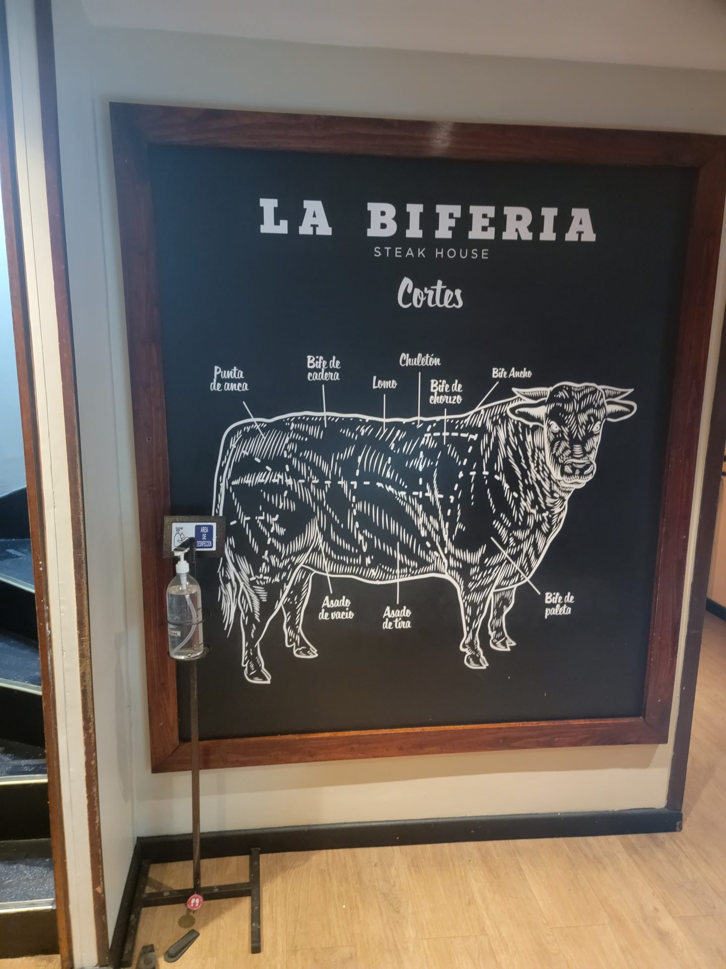a sign with a cow drawing on it