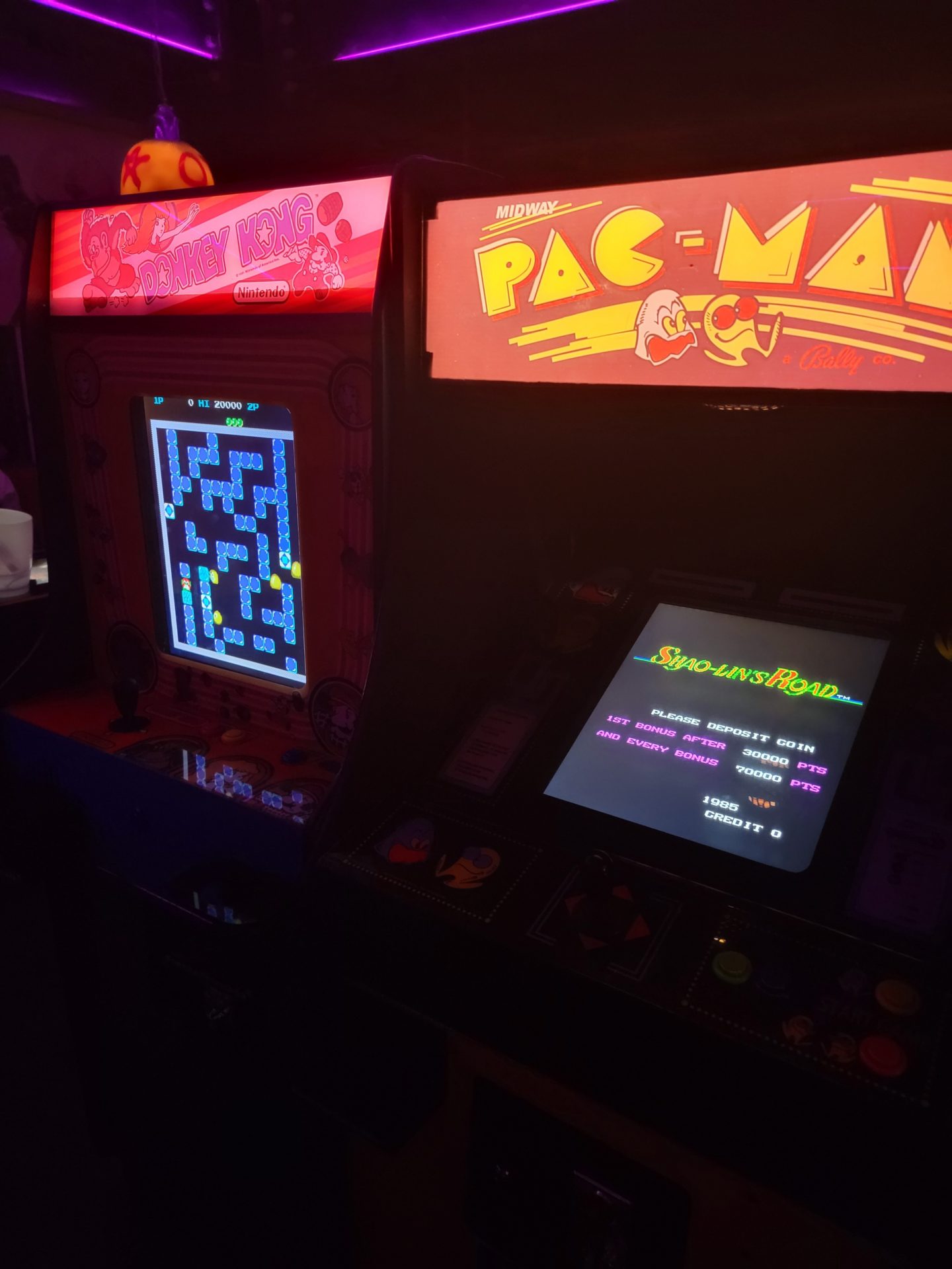 a game machines in a dark room