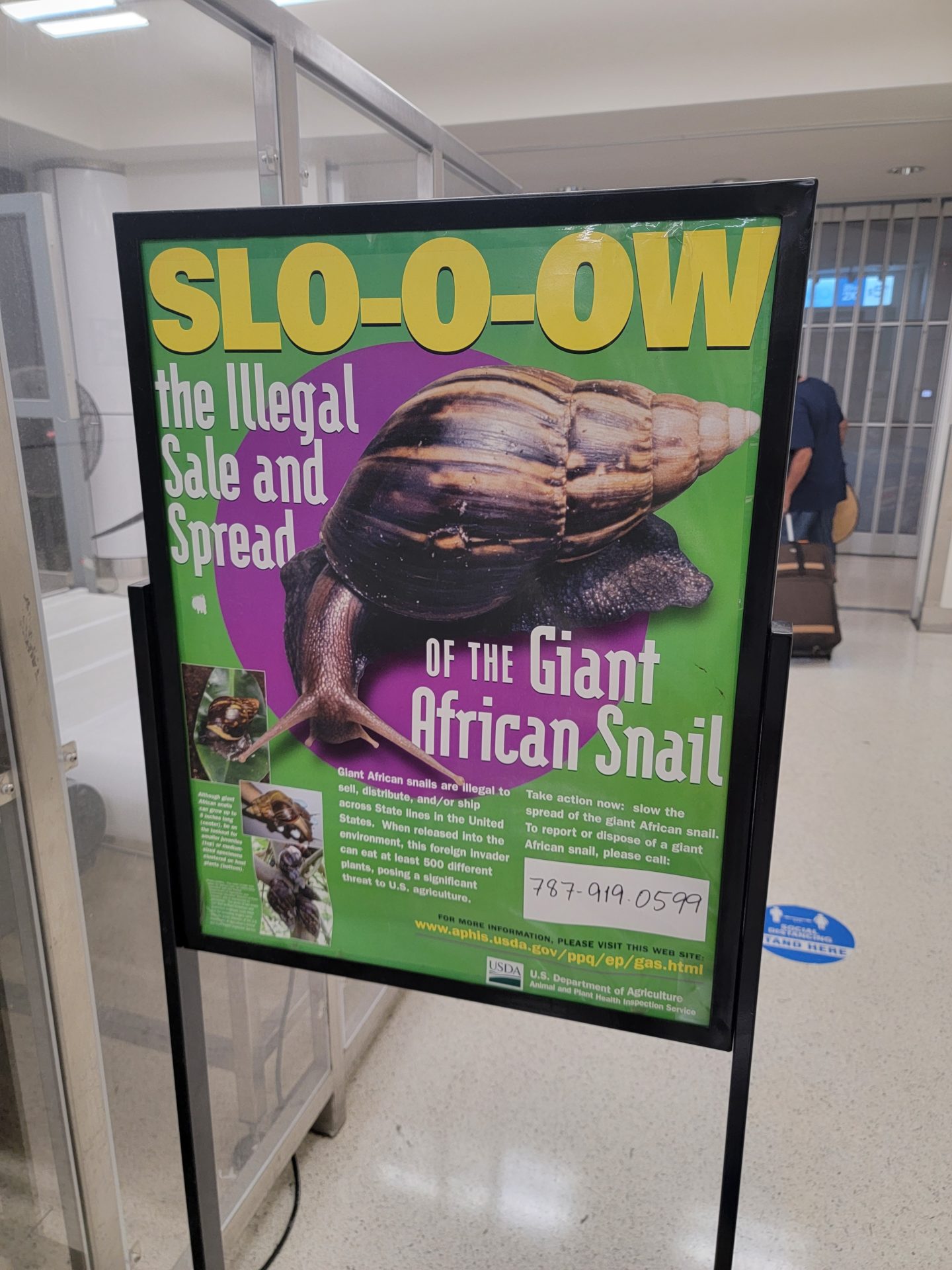 a sign with a snail on it