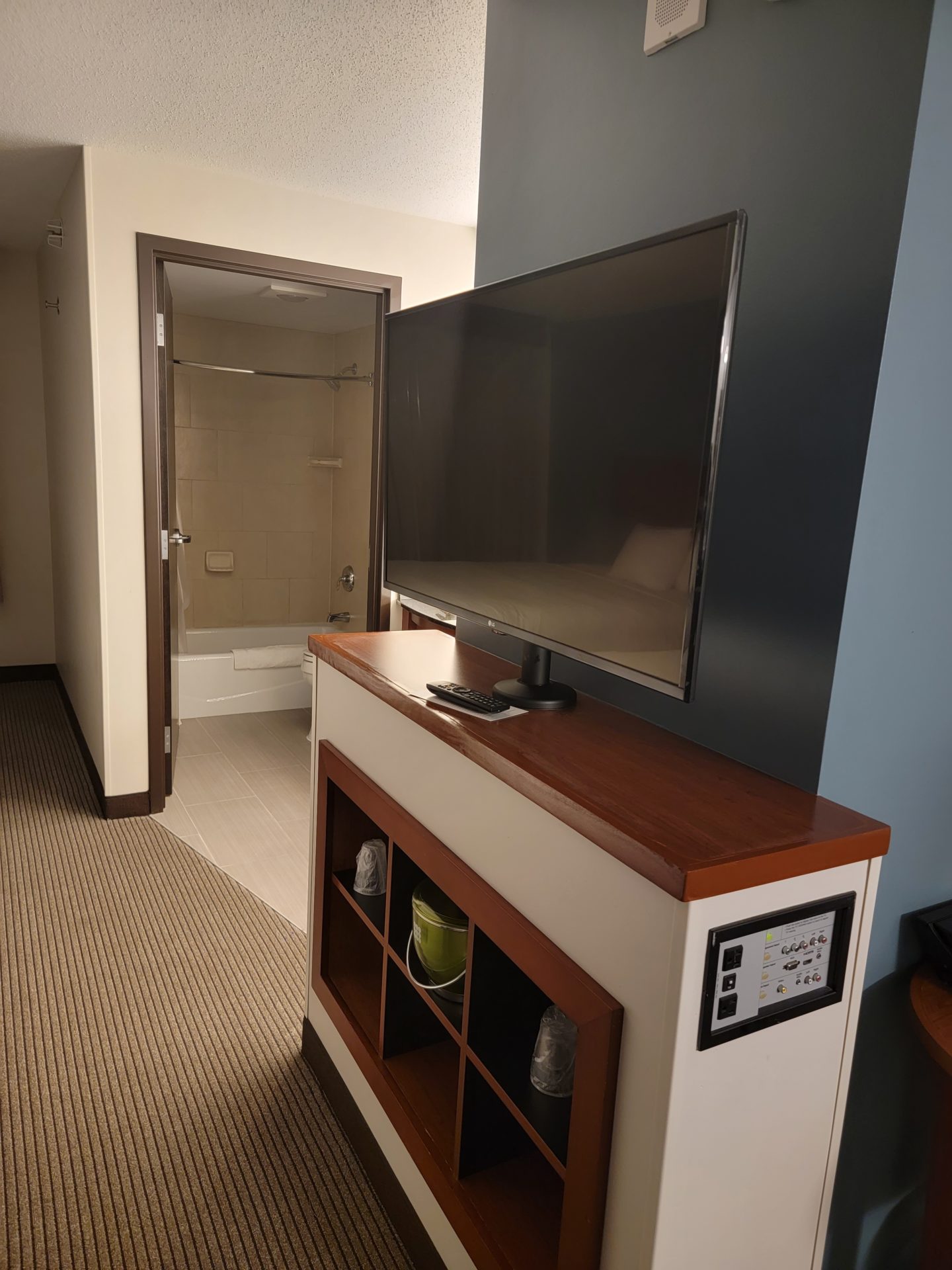 a tv on a shelf in a room