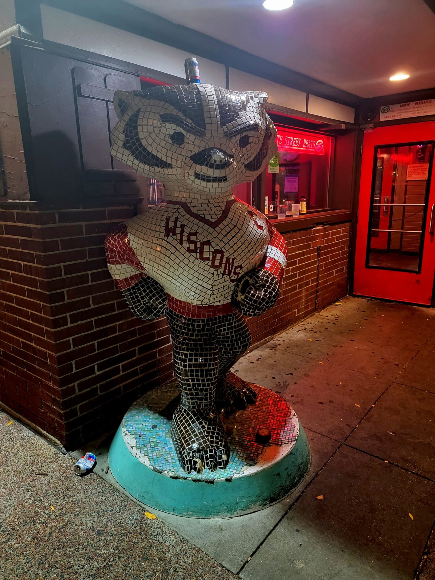 a mosaic sculpture of a raccoon mascot