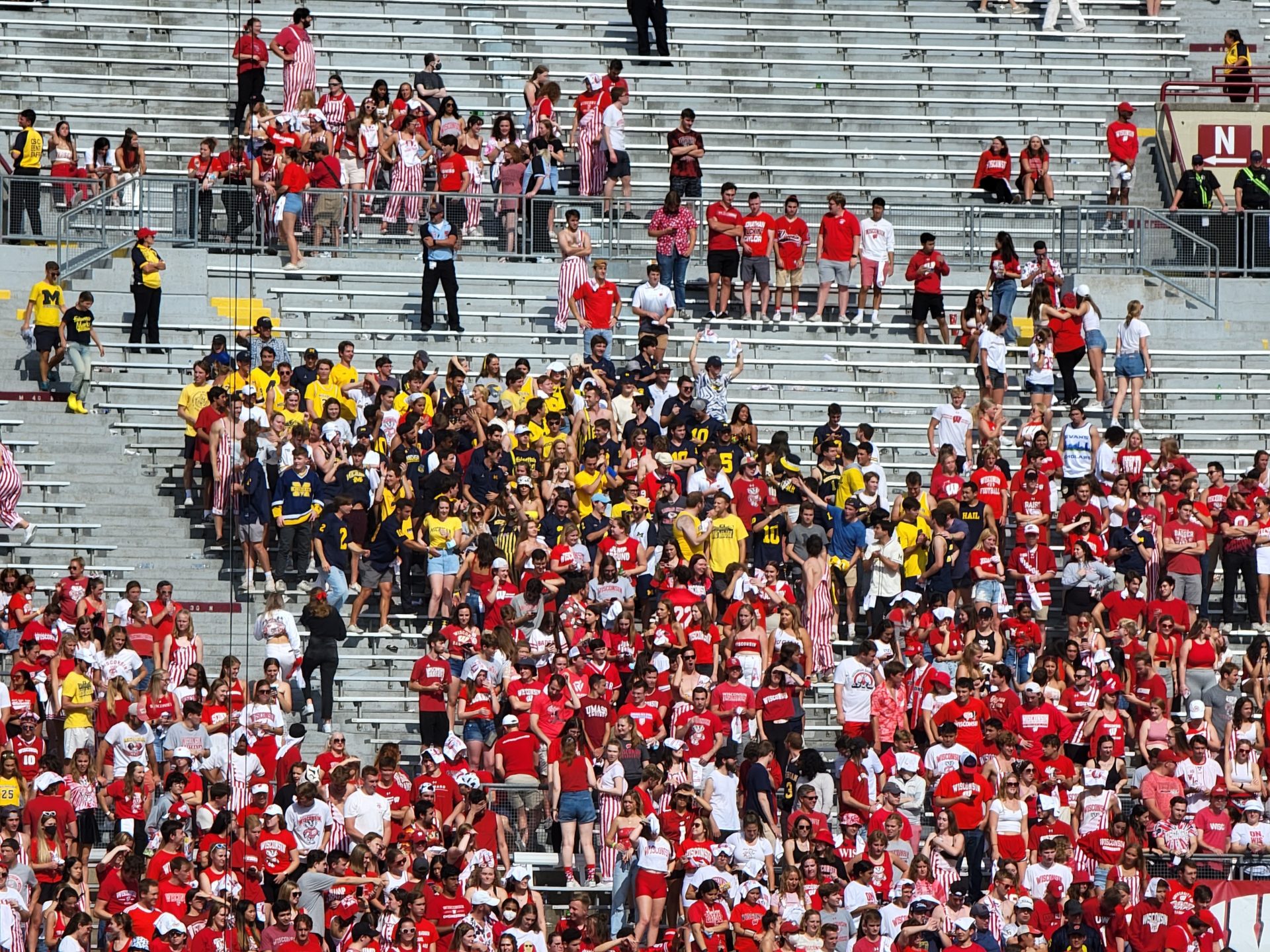 a crowd of people in red shirts
