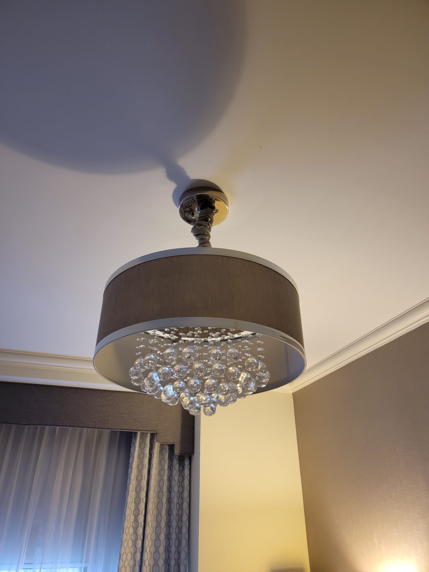 a chandelier with crystal balls from the ceiling