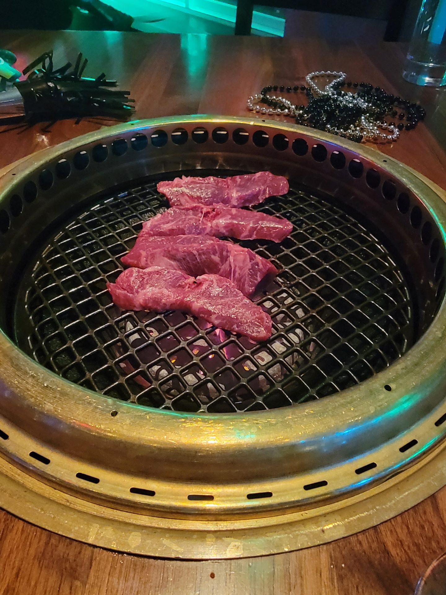 meat on a grill with a chain around it