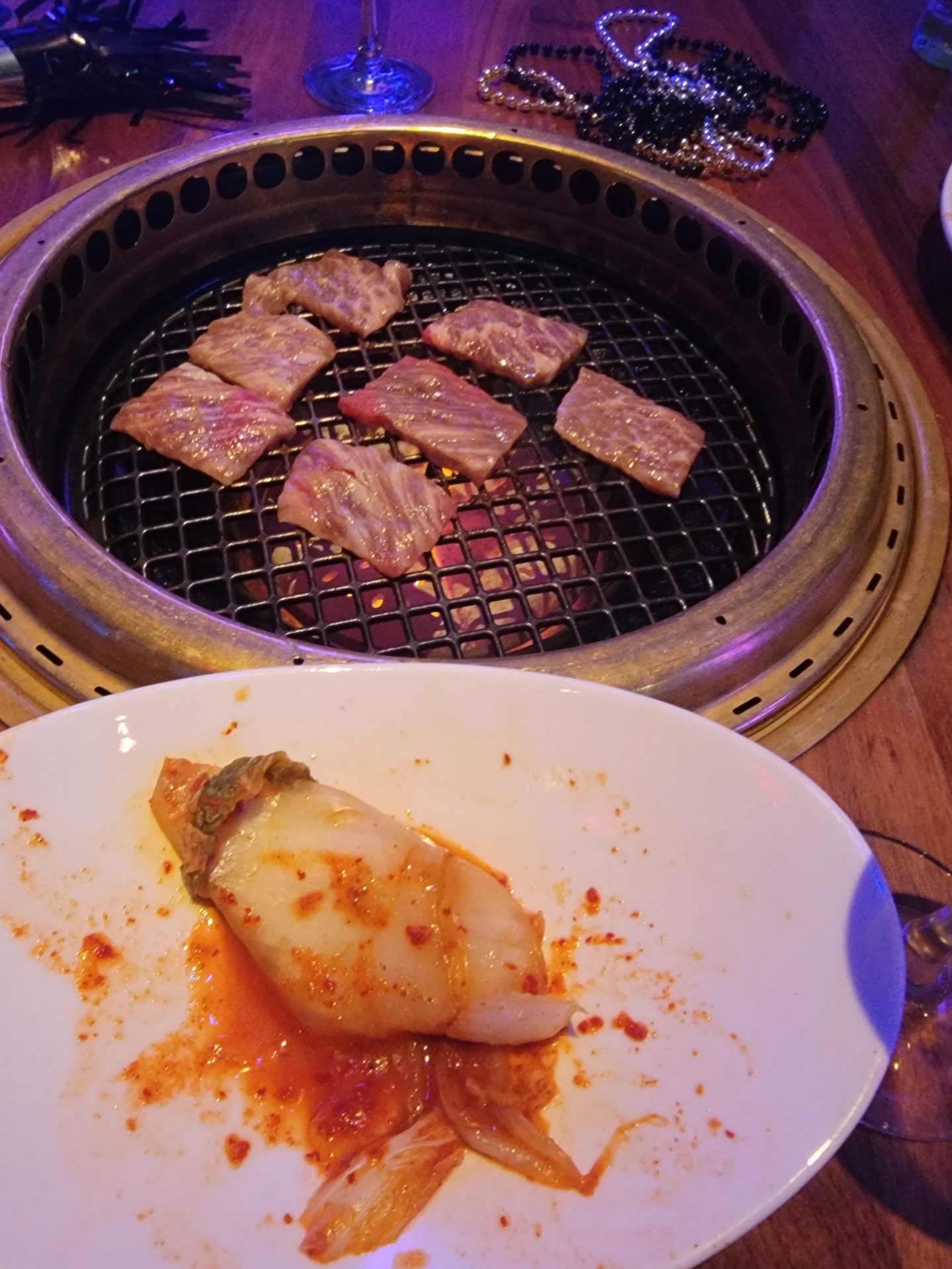 a plate of meat on a grill