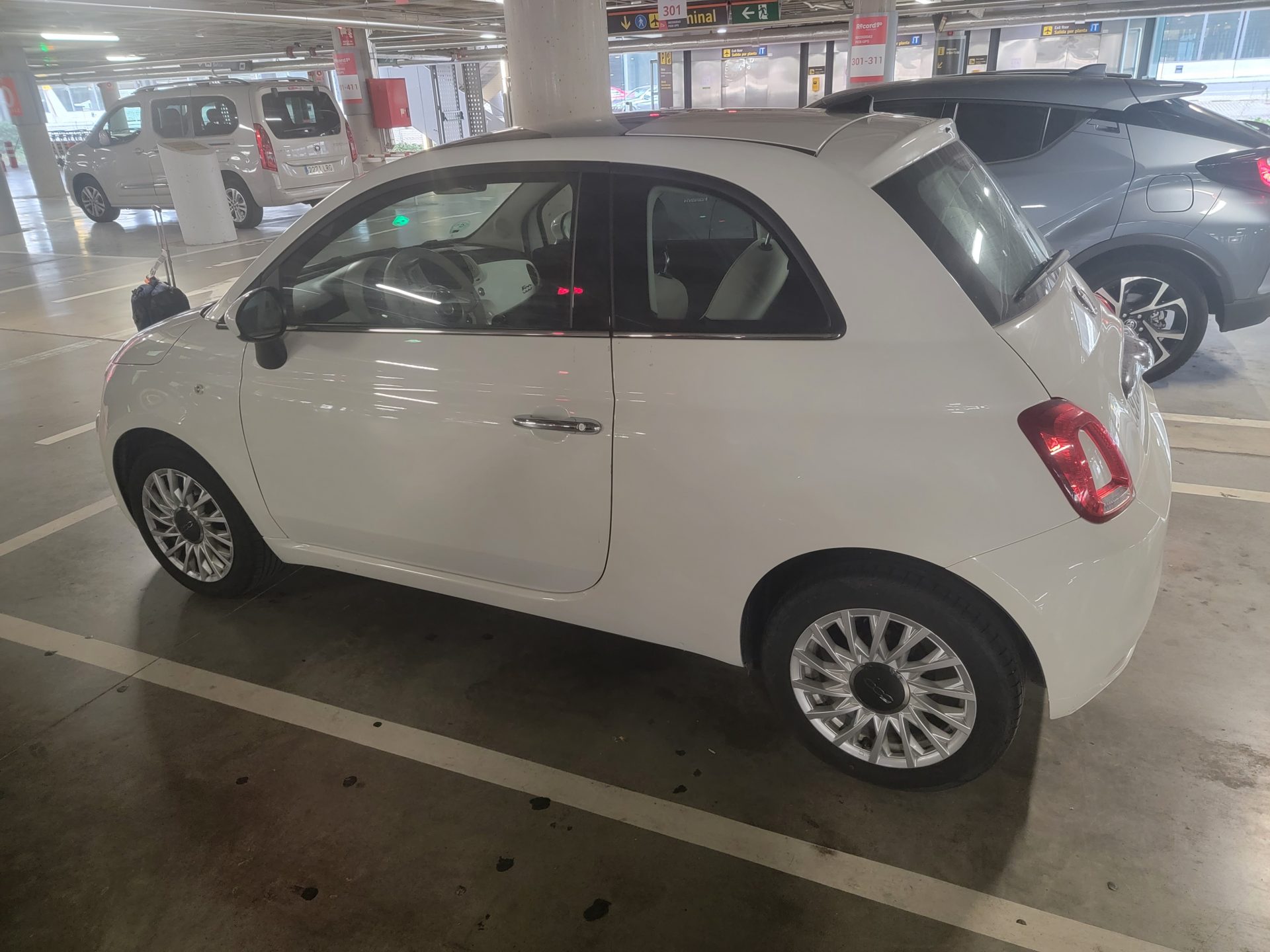 a white car in a parking lot