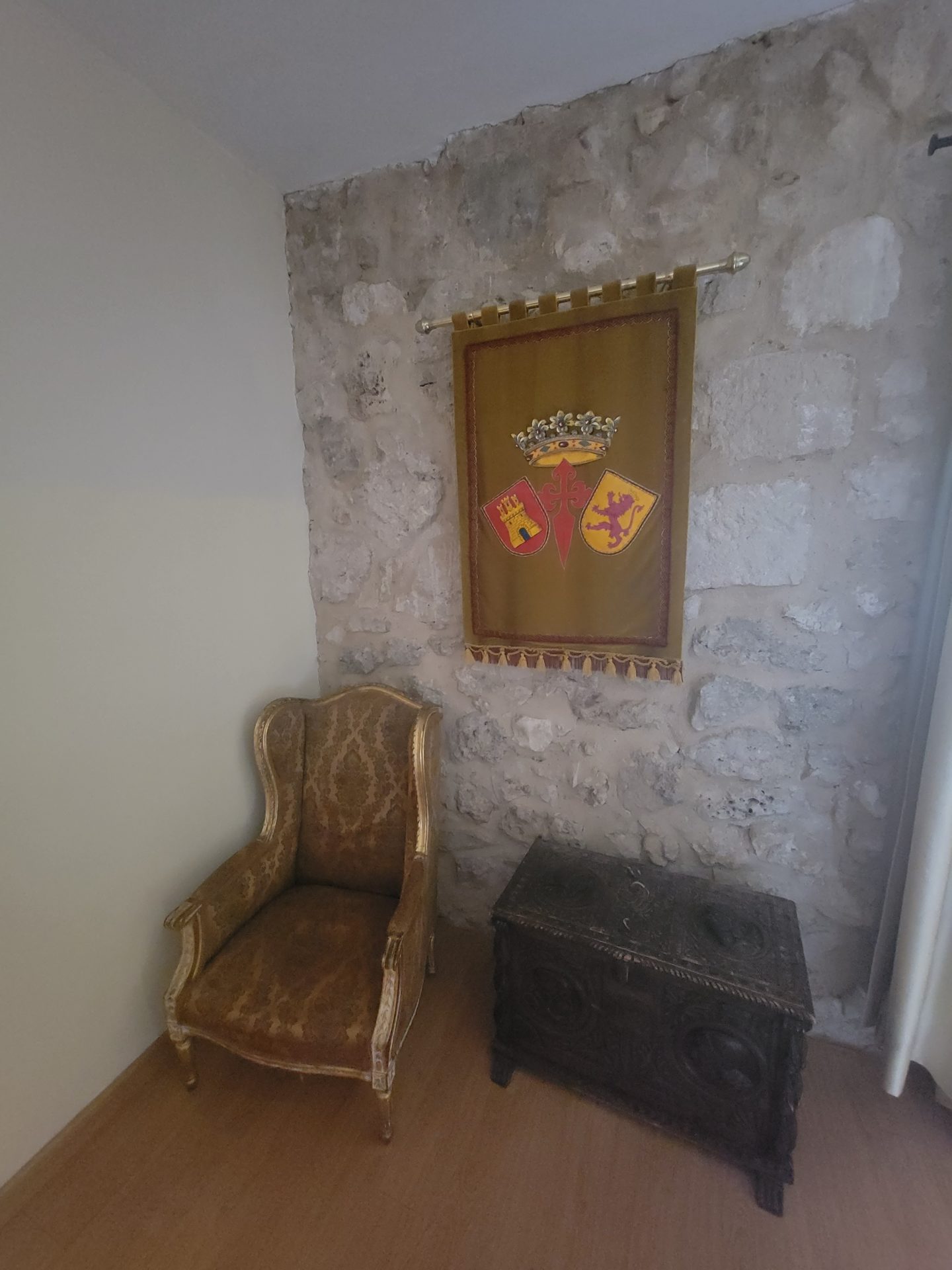 a chair and chest in a room