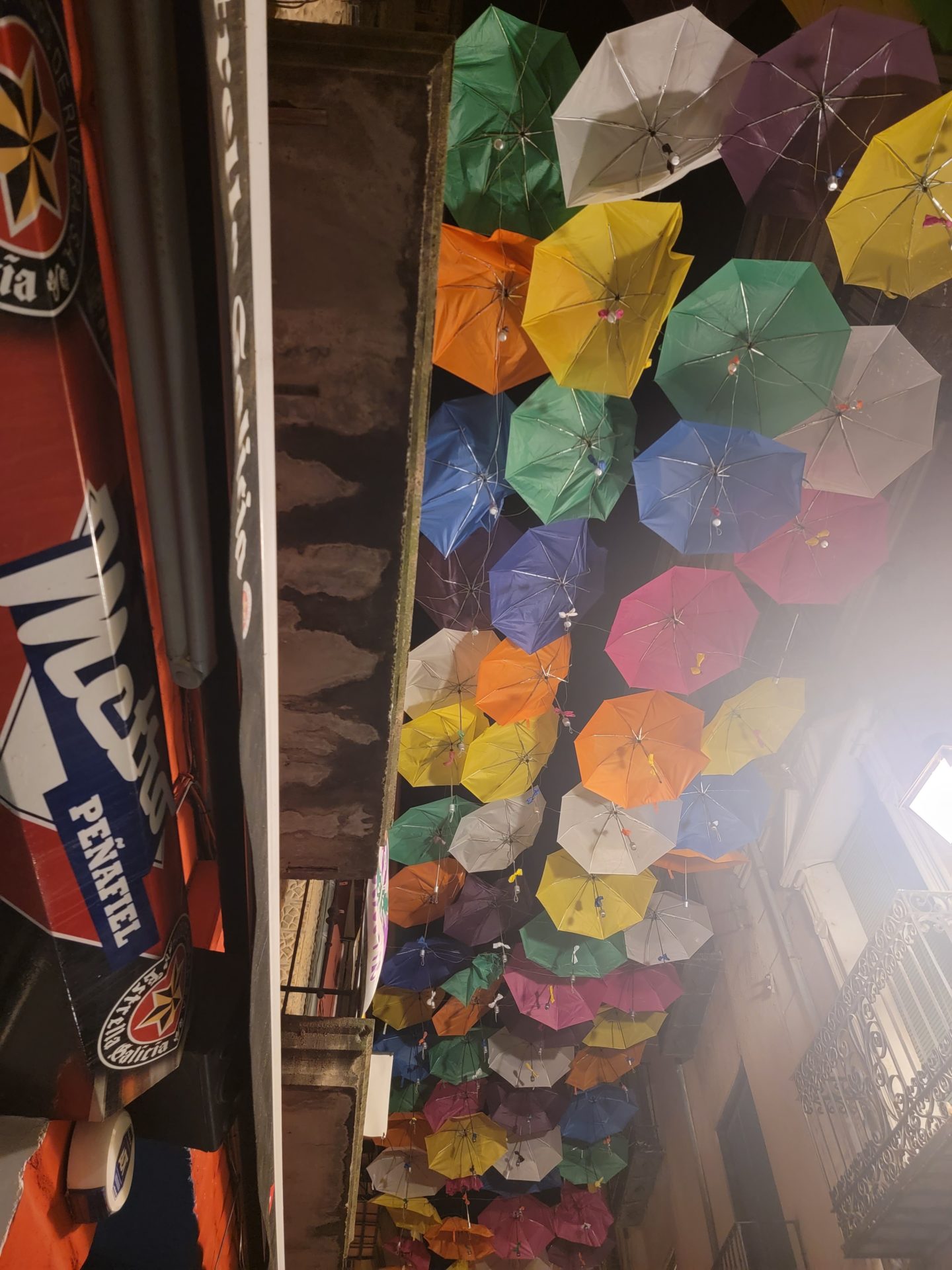 a group of umbrellas from a wall