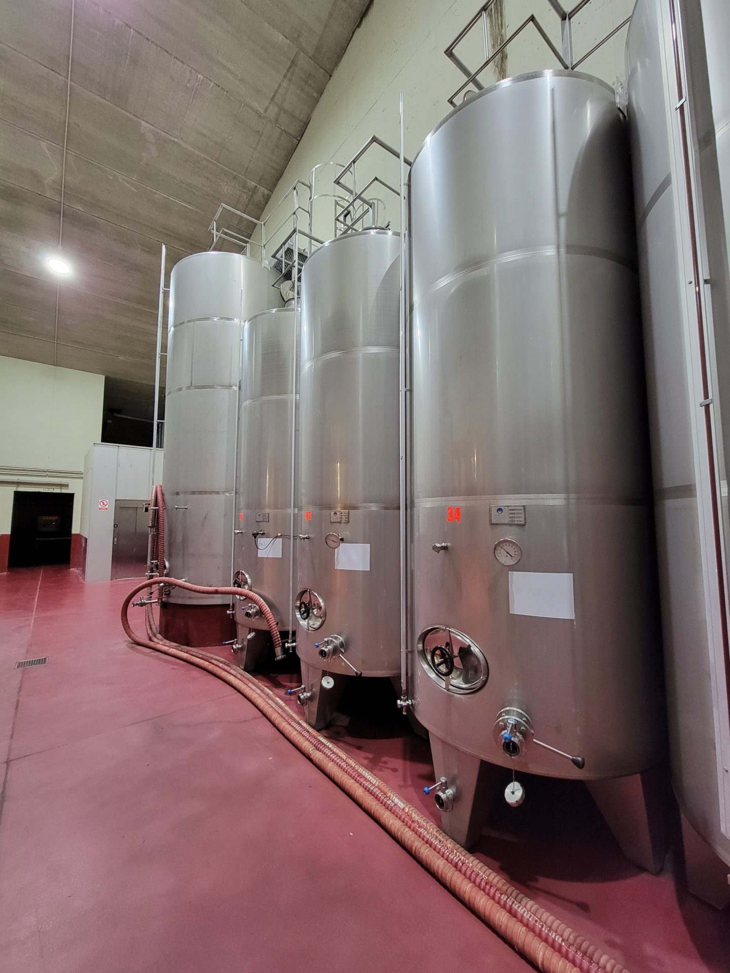 a group of large silver tanks