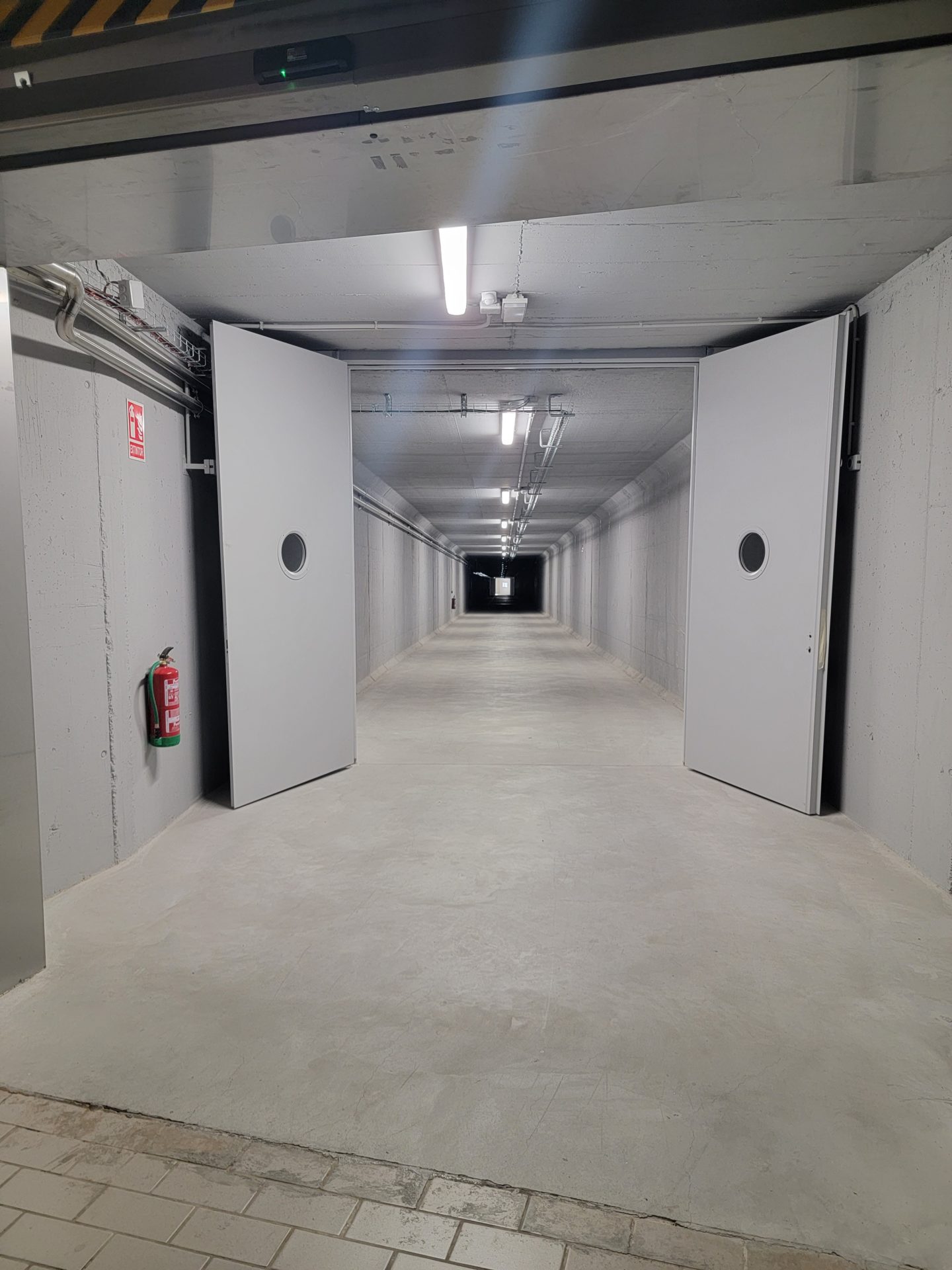 a long hallway with two doors