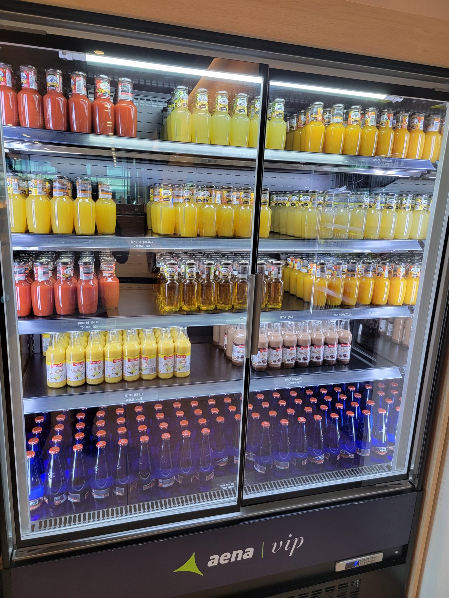 a display case with bottles of juice