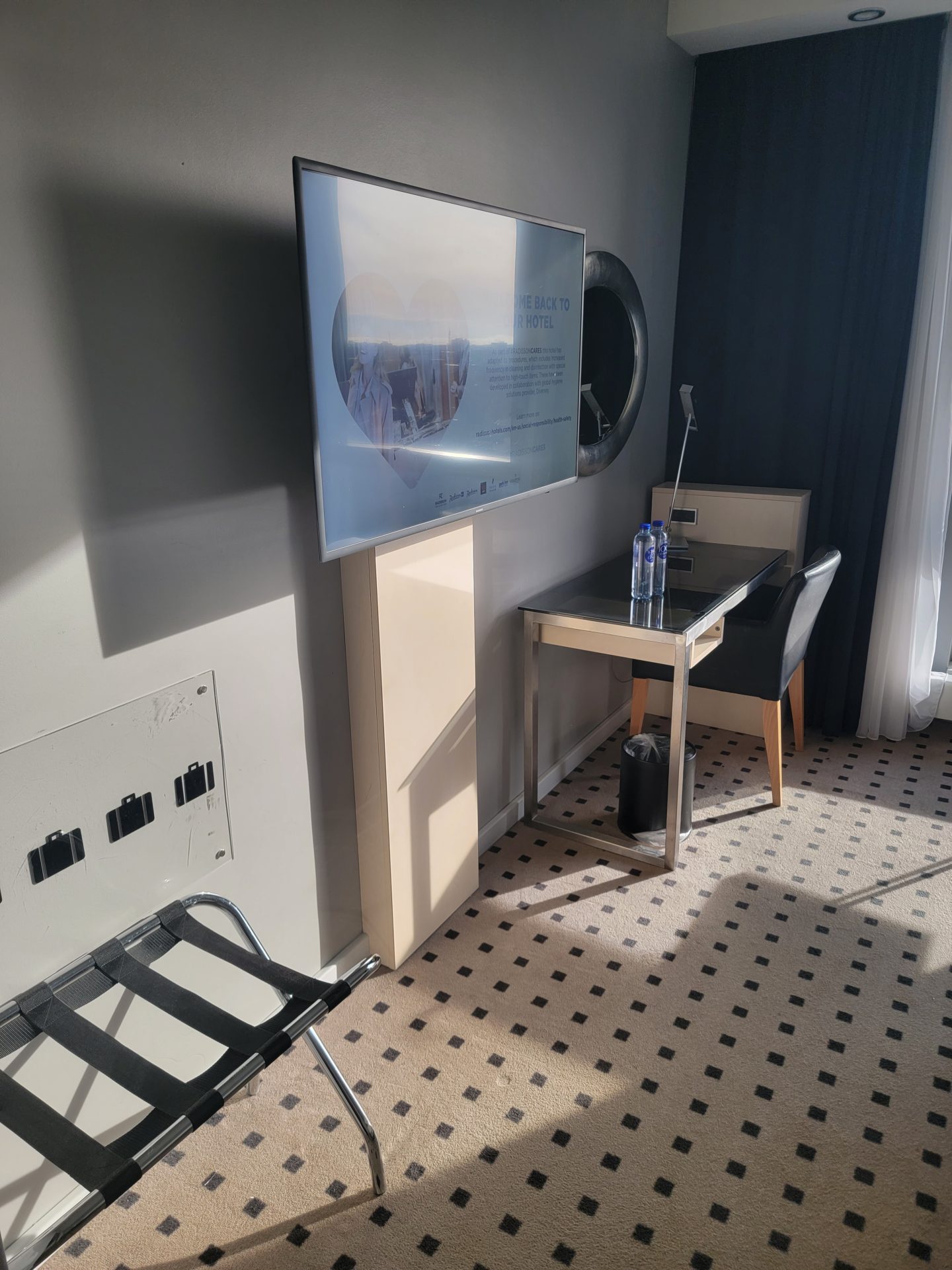 a room with a television and chair