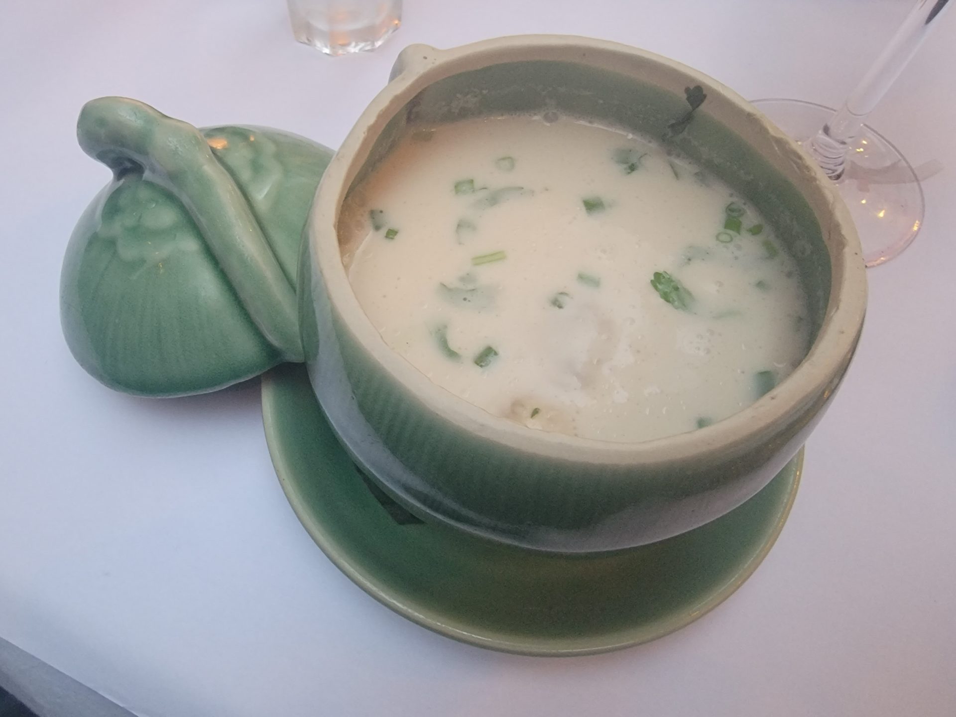 a bowl of soup with a lid