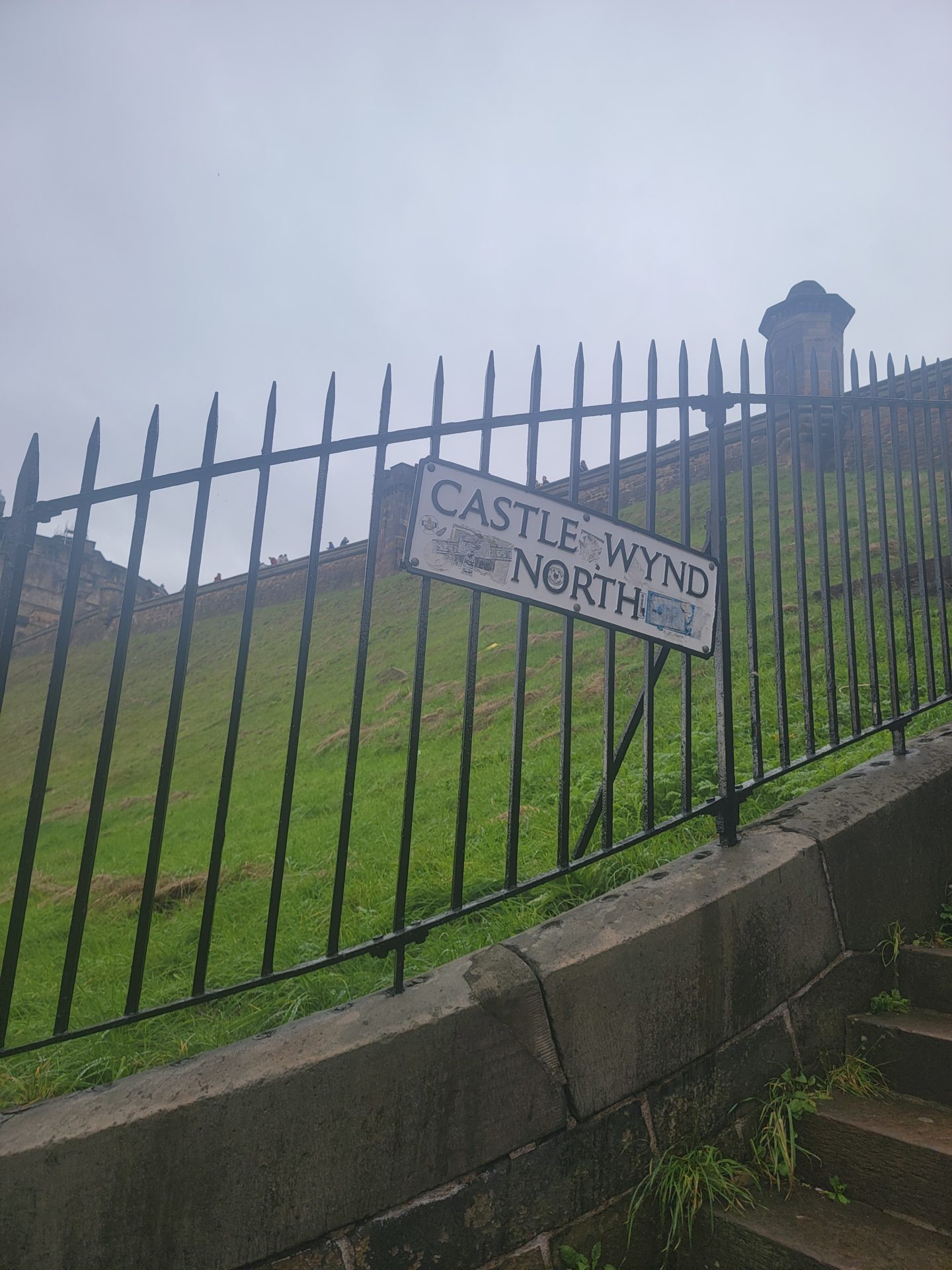 a fence with a sign on it