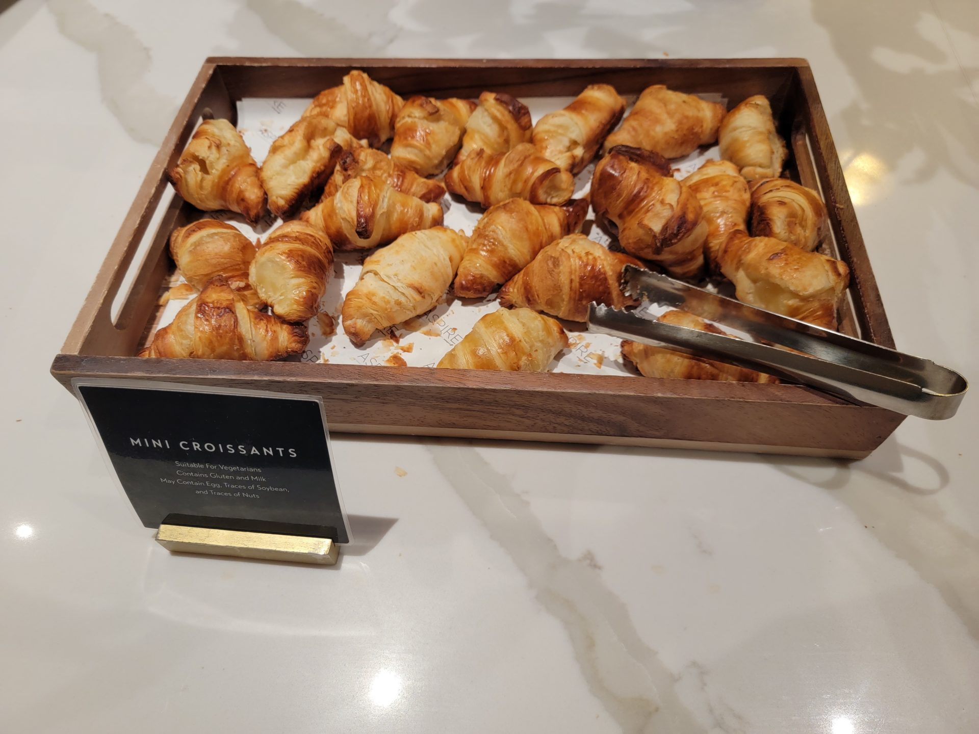 a tray of croissants on a table