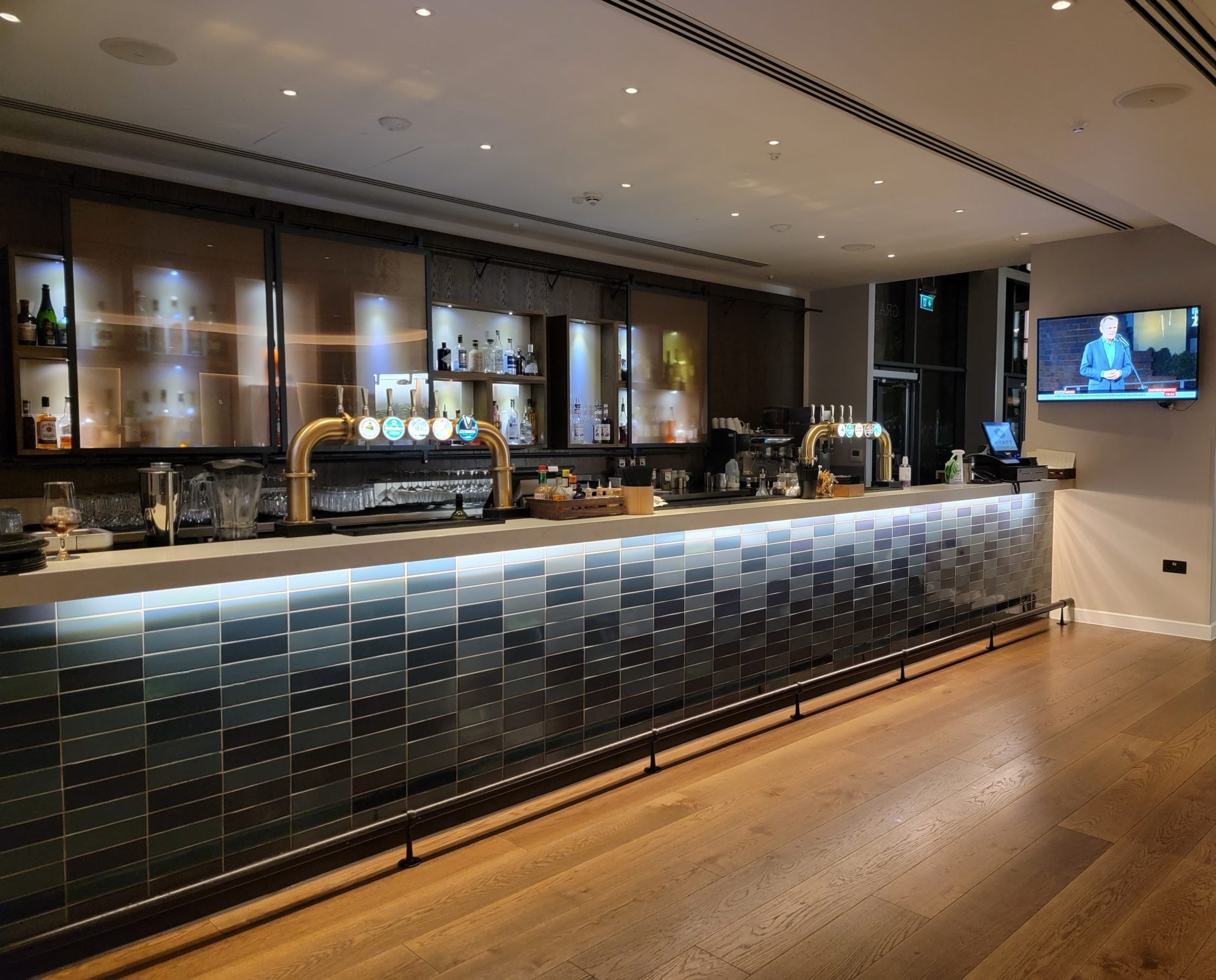 a bar with a tv and shelves