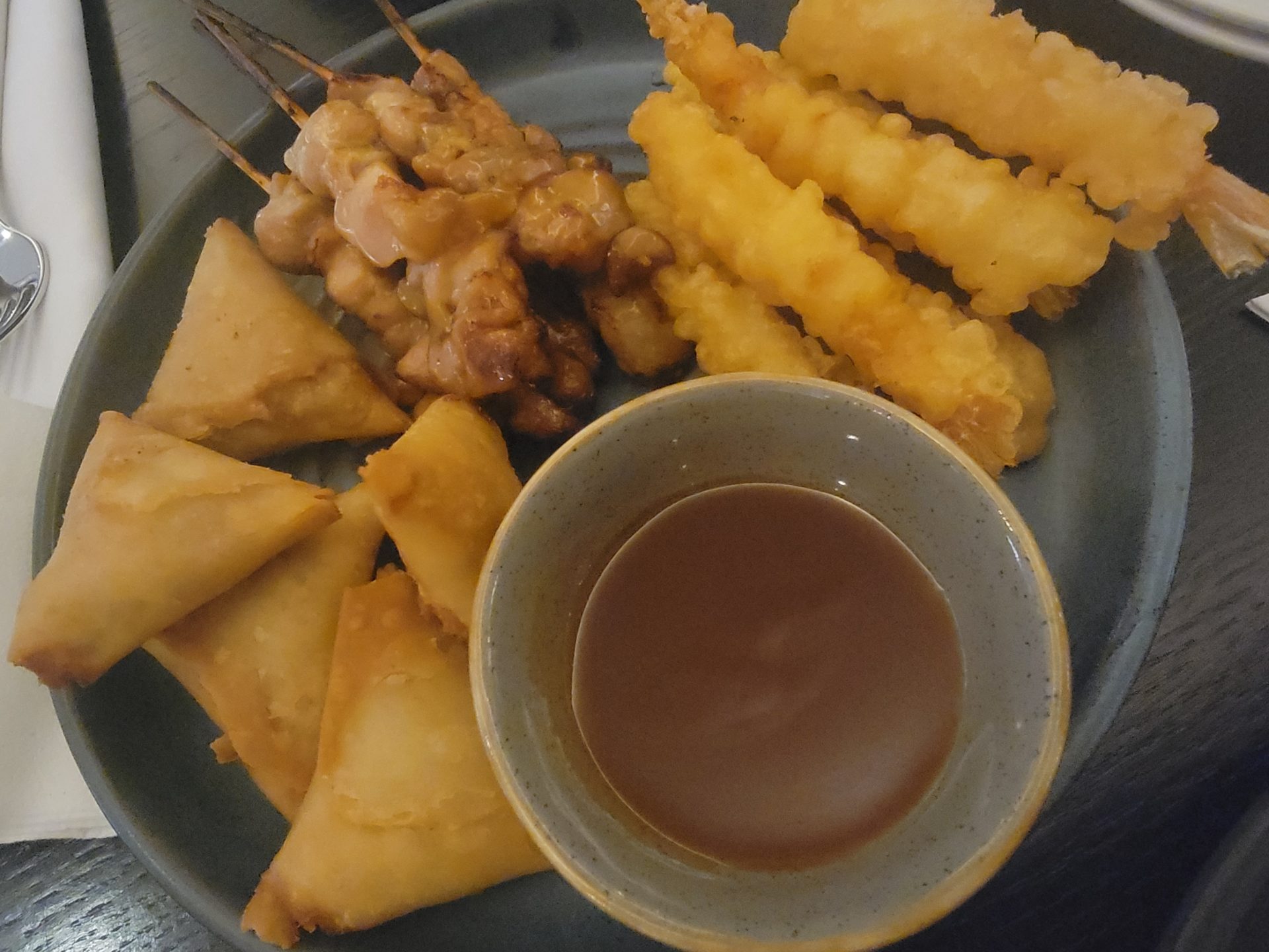 a plate of fried food with sauce