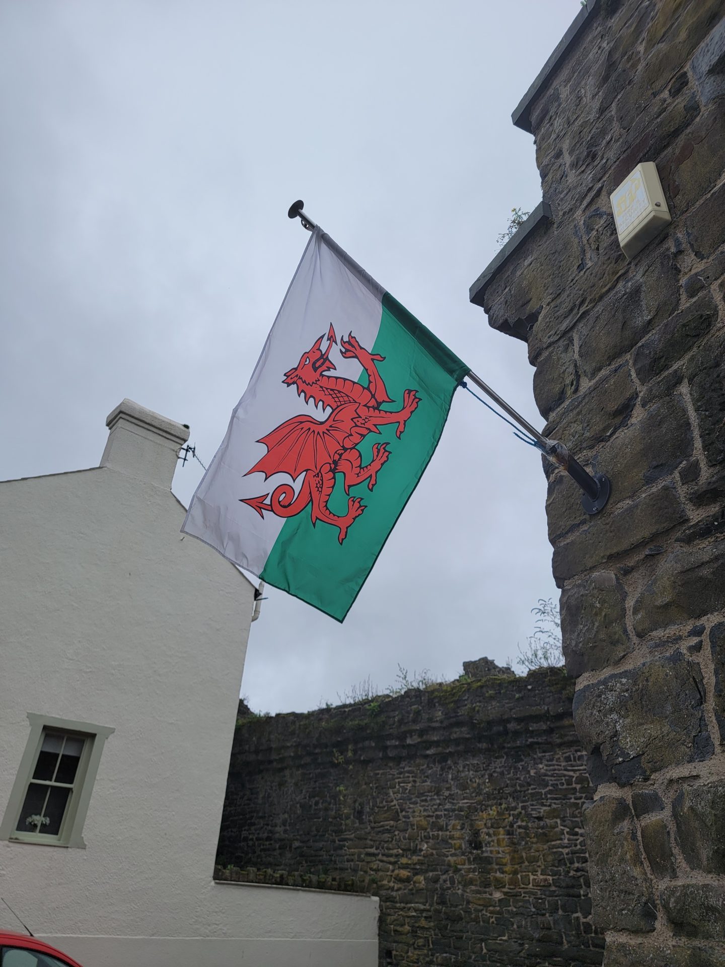 a flag on a stone wall