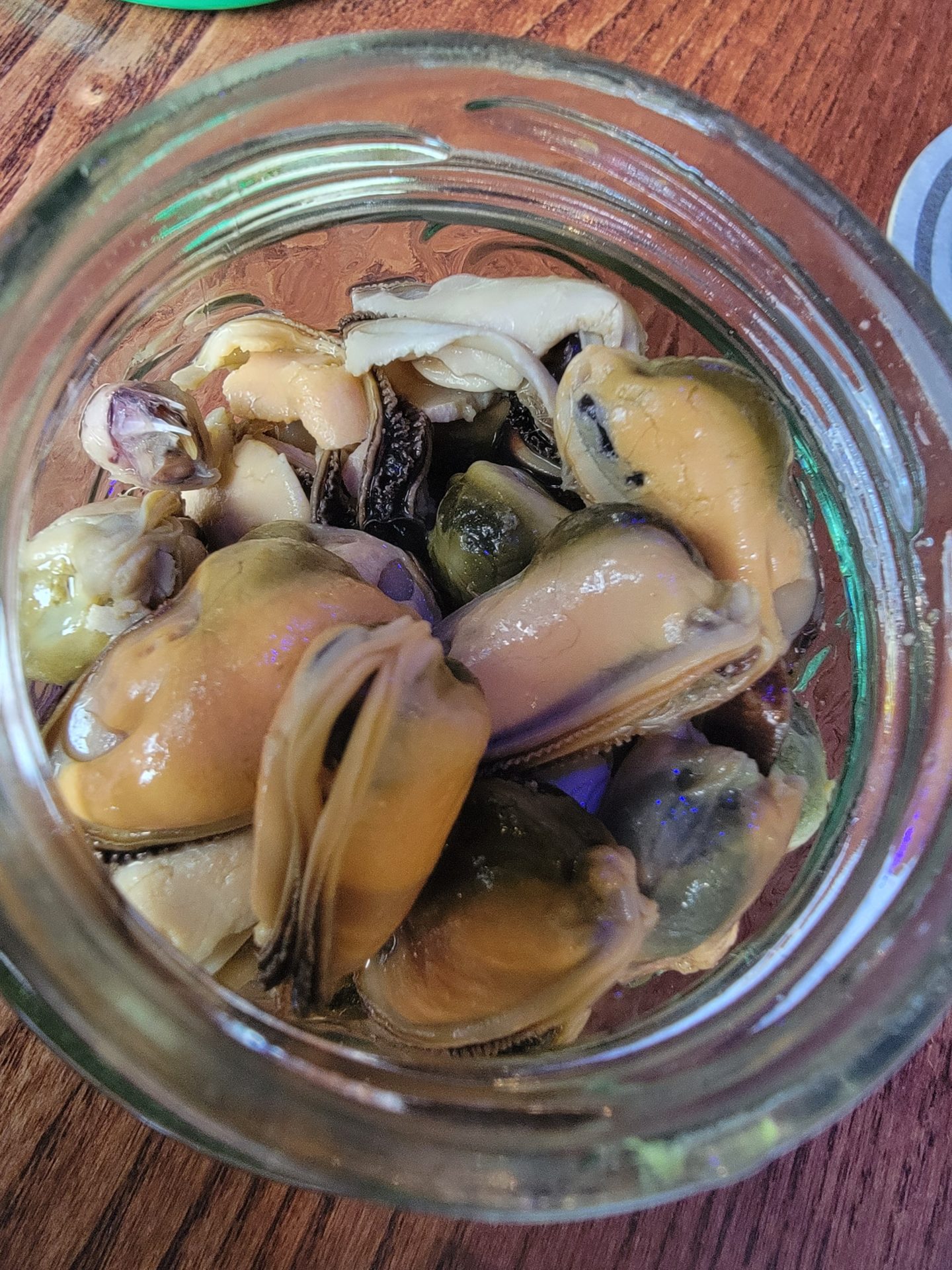 a glass jar of mussels
